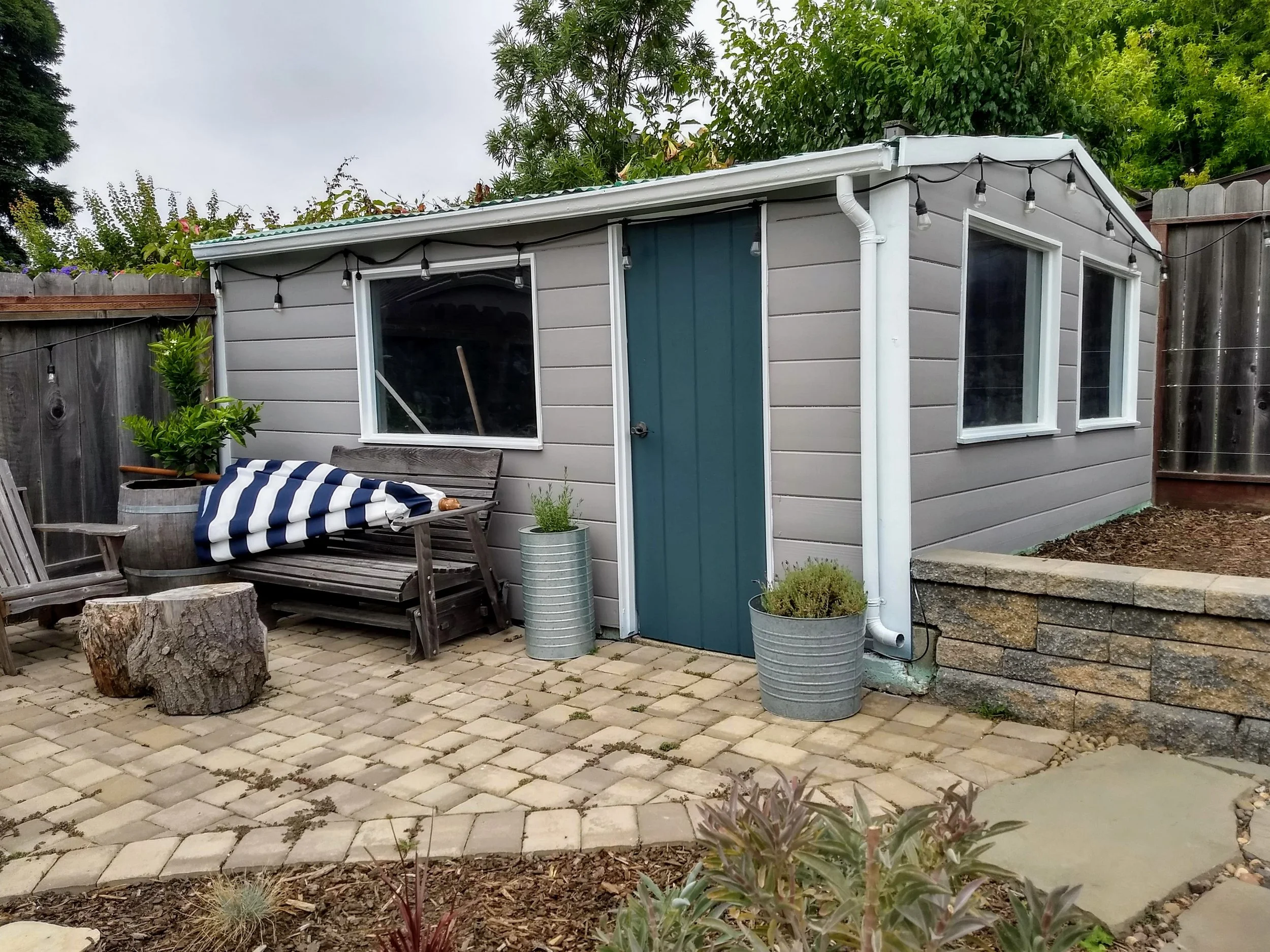 Exterior house painting of siding, trim, and front door completed in El Cerrito, CA