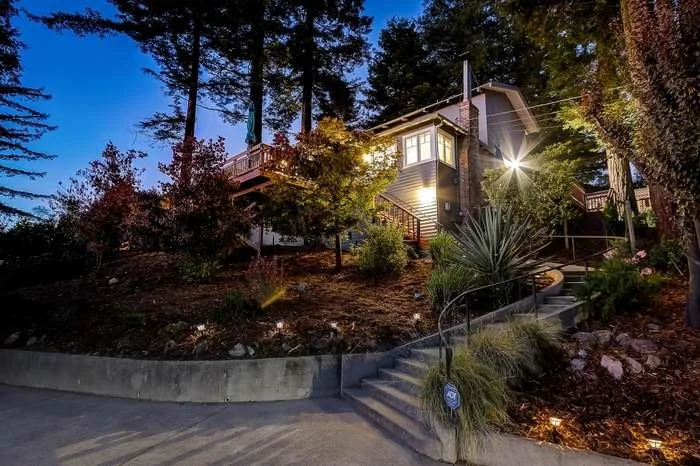 Exterior house repaint with fresh siding and trim paint completed in Oakland, California.