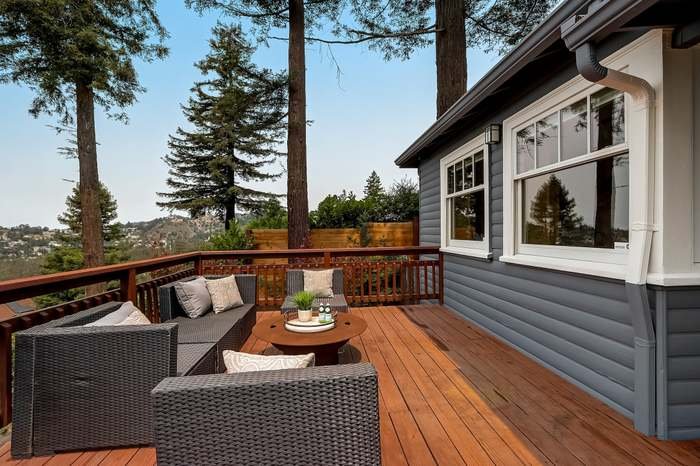 Exterior house repaint with fresh siding and trim paint completed in Oakland, California.