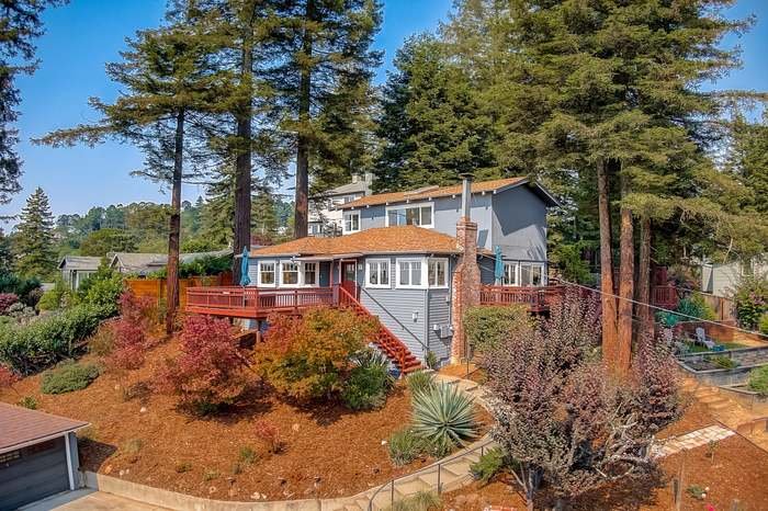 Exterior house repaint with fresh siding and trim paint completed in Oakland, California.