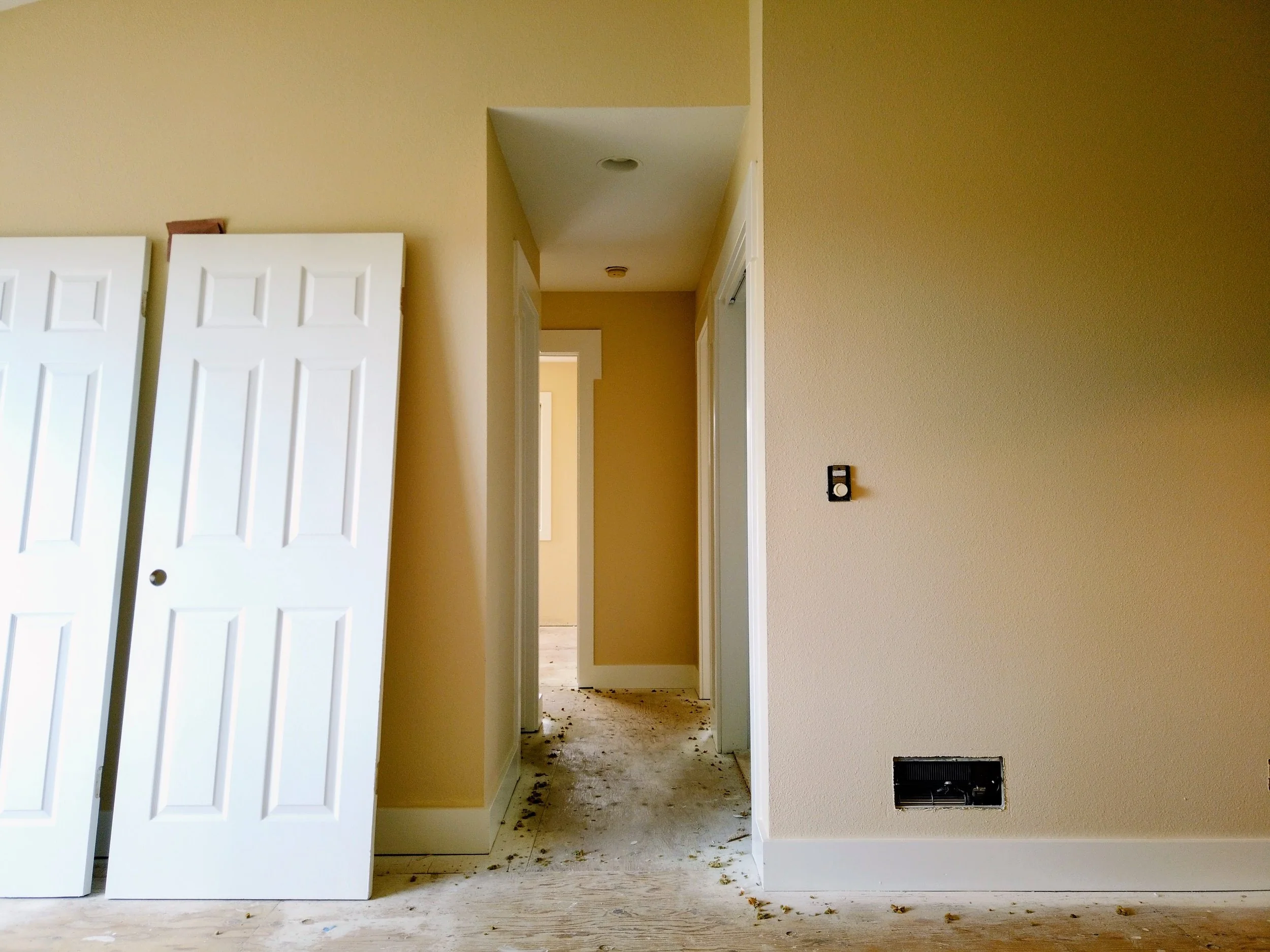 A fresh coat of paint was applied to the trim, the ceiling, the doors and the walls in this living room for a rental property located in the Dimond district of Oakland.