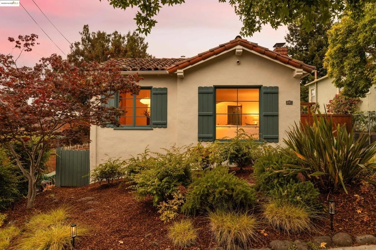 Exterior painting of a historic home with detailed trim restoration in Oakland, CA