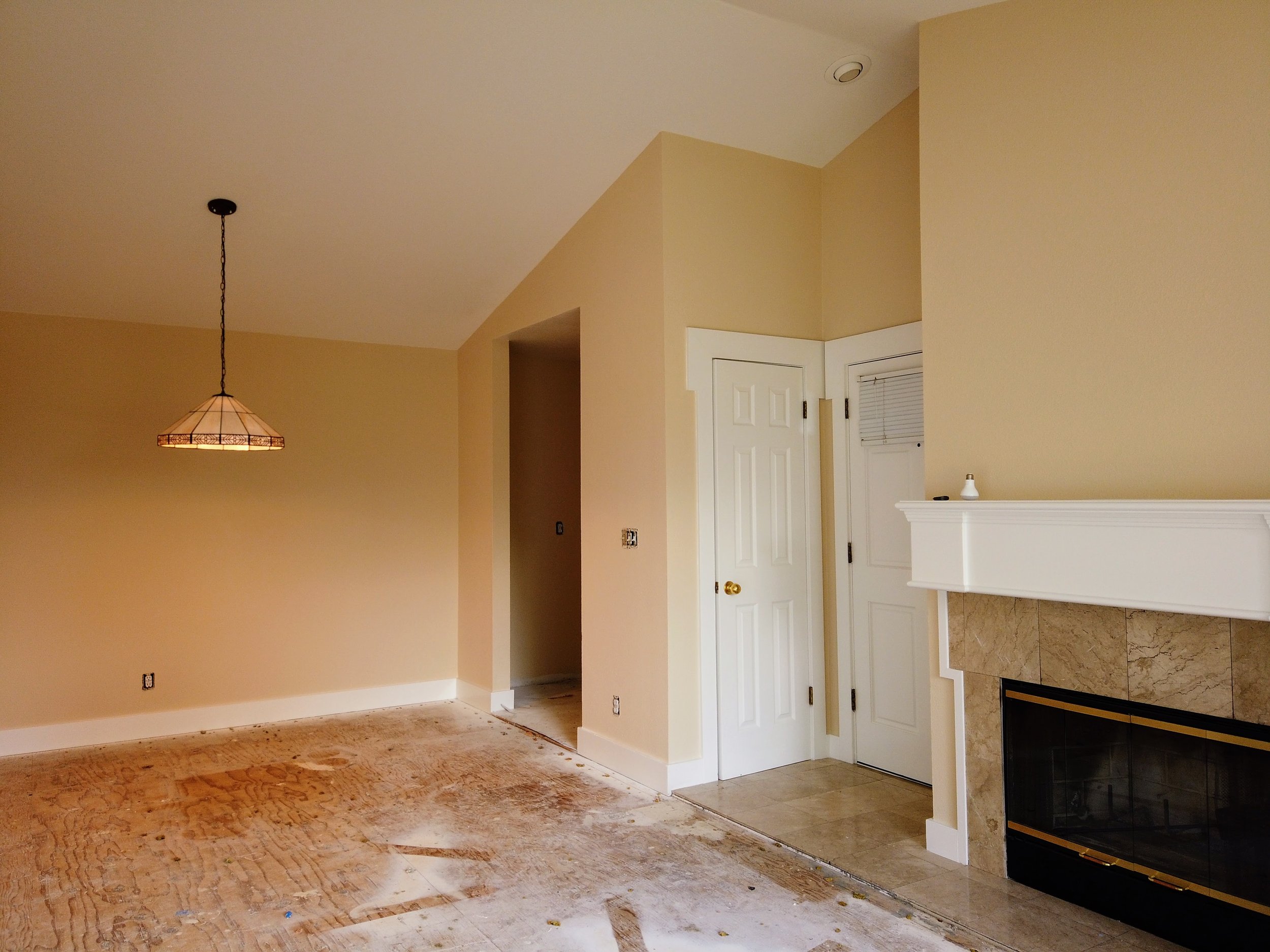 A fresh coat of paint was applied to the trim, the ceiling, and the walls in this entry and dining room located in the Dimond district of Oakland.