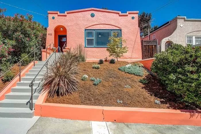 Residential exterior repaint with smooth siding coverage and clean trim lines in the East Bay.