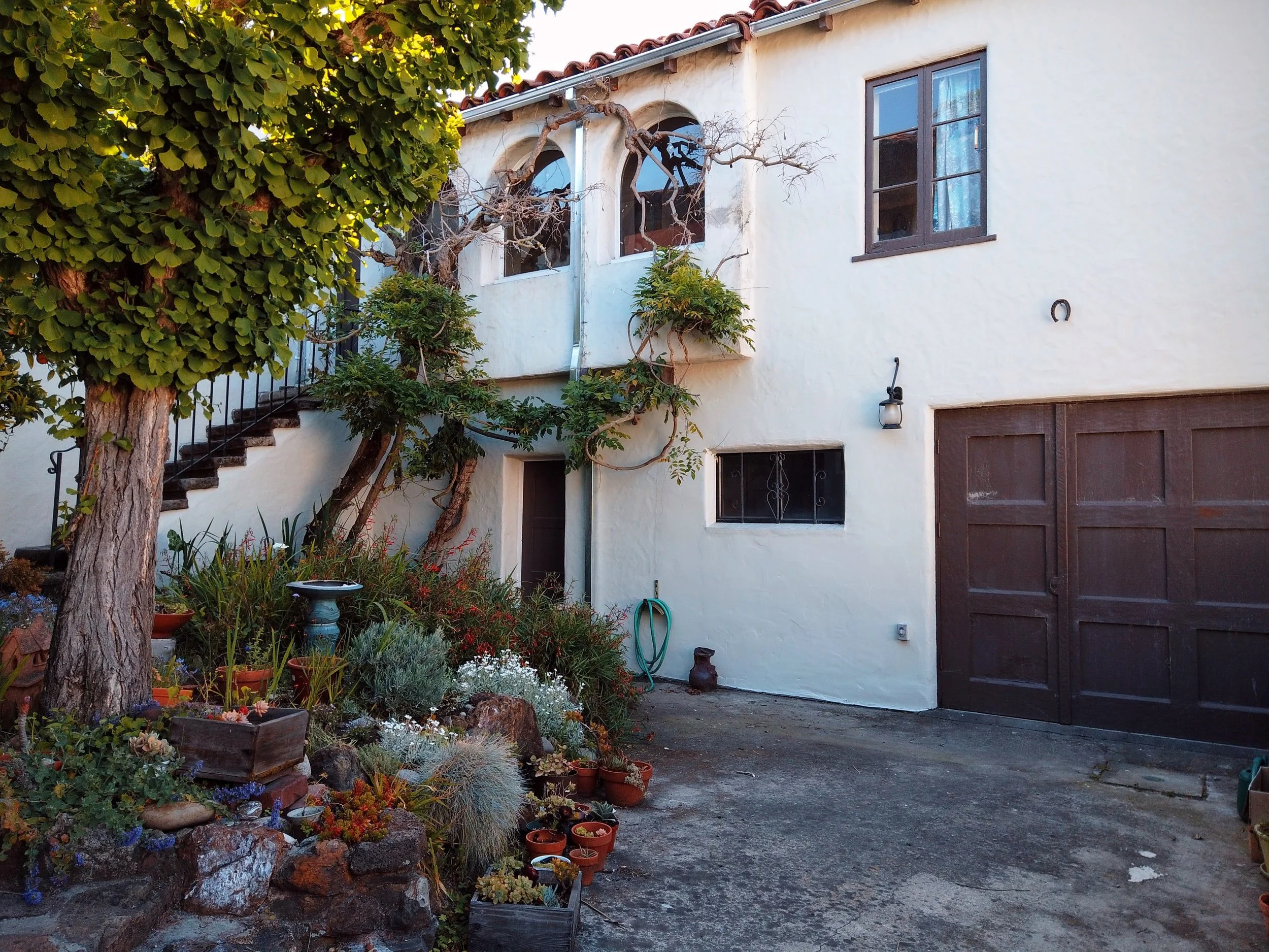 Exterior painting of a historic home with detailed trim restoration in Berkeley, CA.