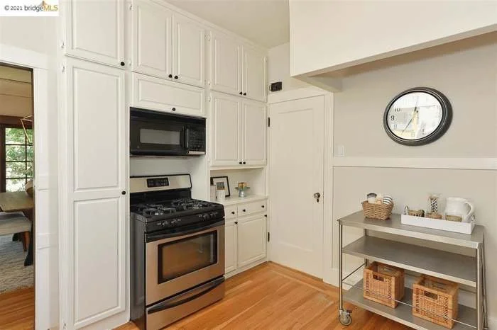 A durable coat of paint was applied to the ceiling, walls, cabinets, and trim in this kitchen located in Piedmont.