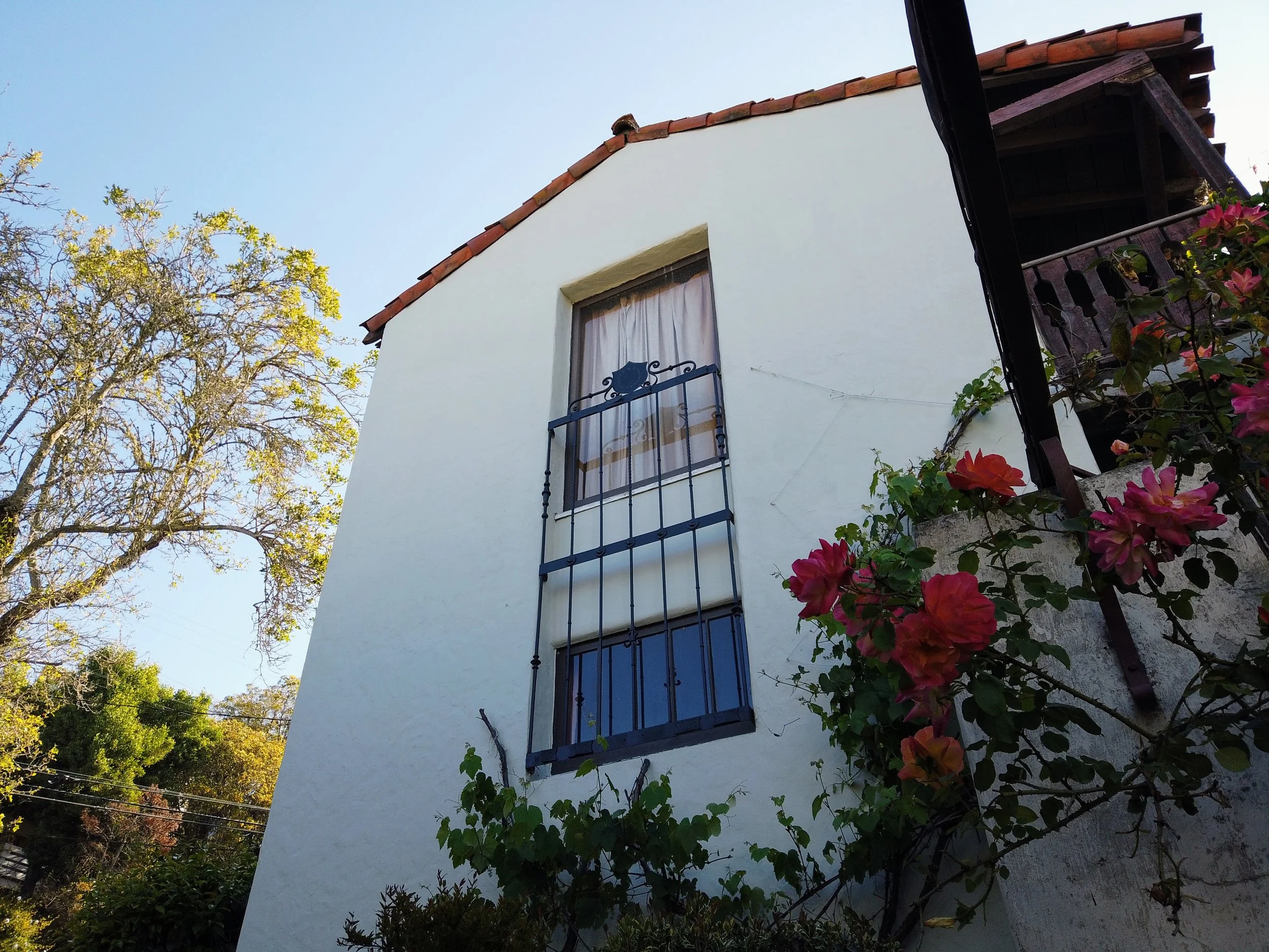 Exterior painting of a historic home with detailed trim restoration in Berkeley, CA.