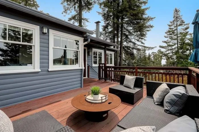 Exterior house repaint with fresh siding and trim paint completed in Oakland, California.