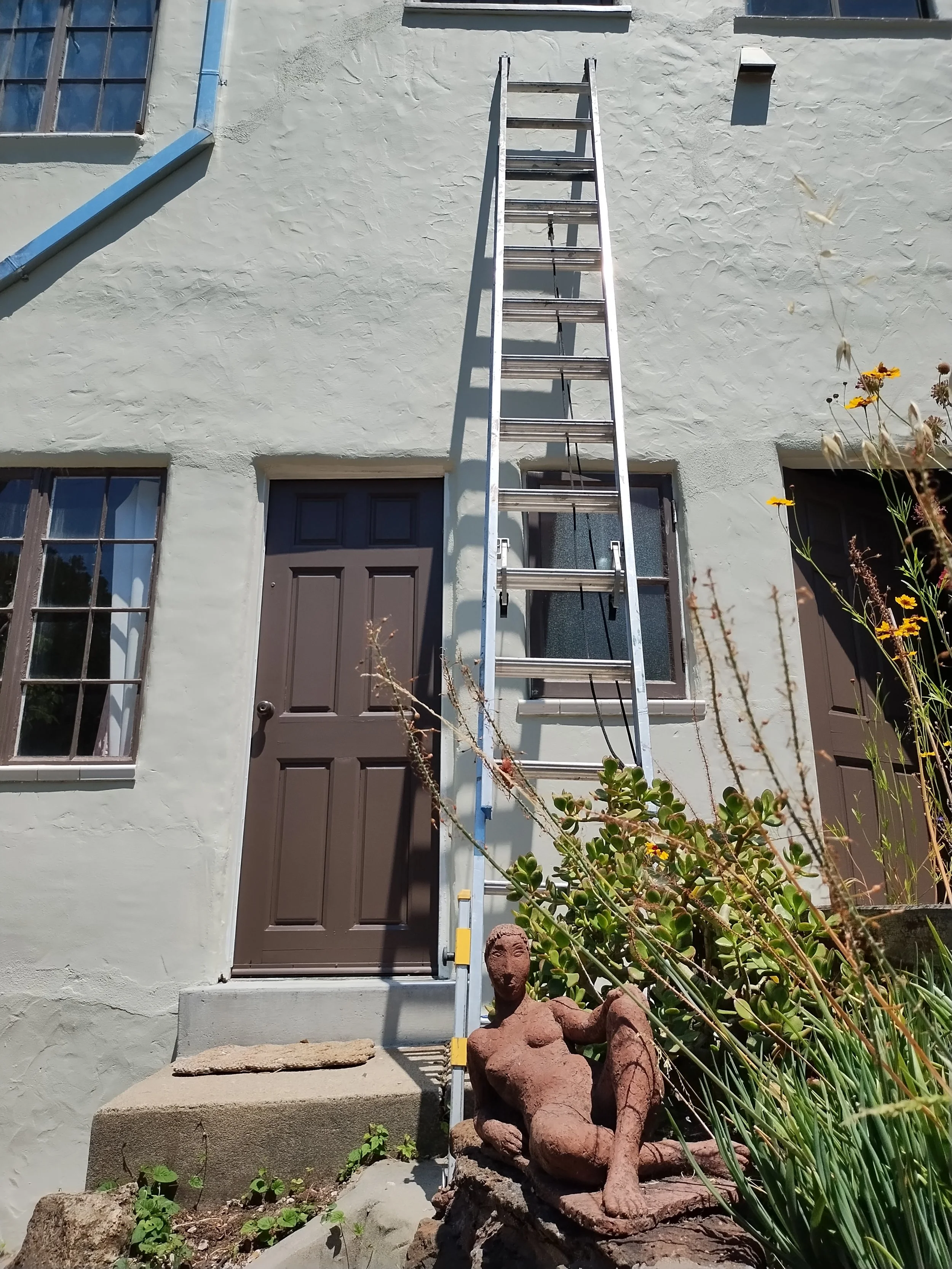 Exterior painting of a historic home with detailed trim restoration in Berkeley, CA. Process shot.