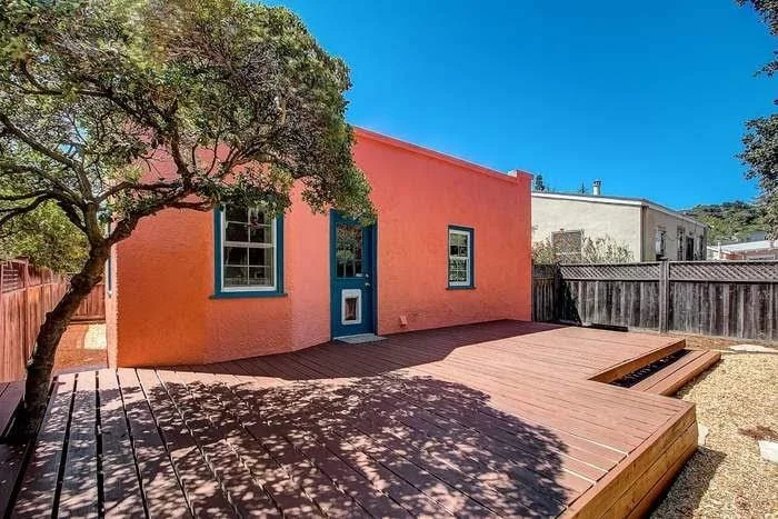 Residential exterior repaint with smooth siding coverage and clean trim lines in the East Bay.