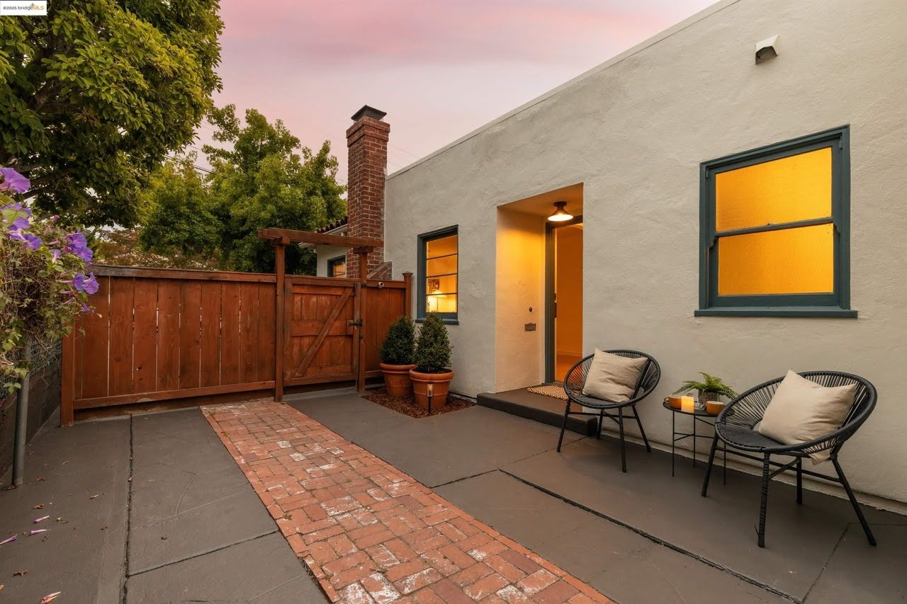 Exterior painting of a historic home with detailed trim restoration in Oakland, CA