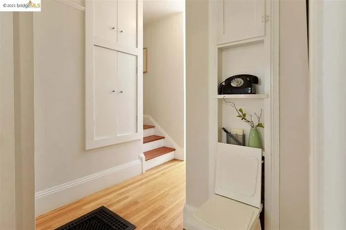 A fresh coat of paint was applied to the trim, the ceiling, and the walls in this hallway located in Piedmont.