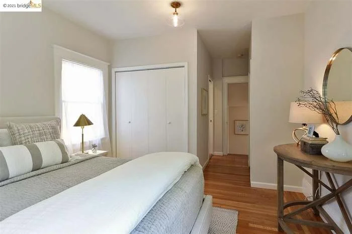 A fresh coat of paint was applied to the trim, the ceiling, and the walls in this bedroom located in Piedmont.