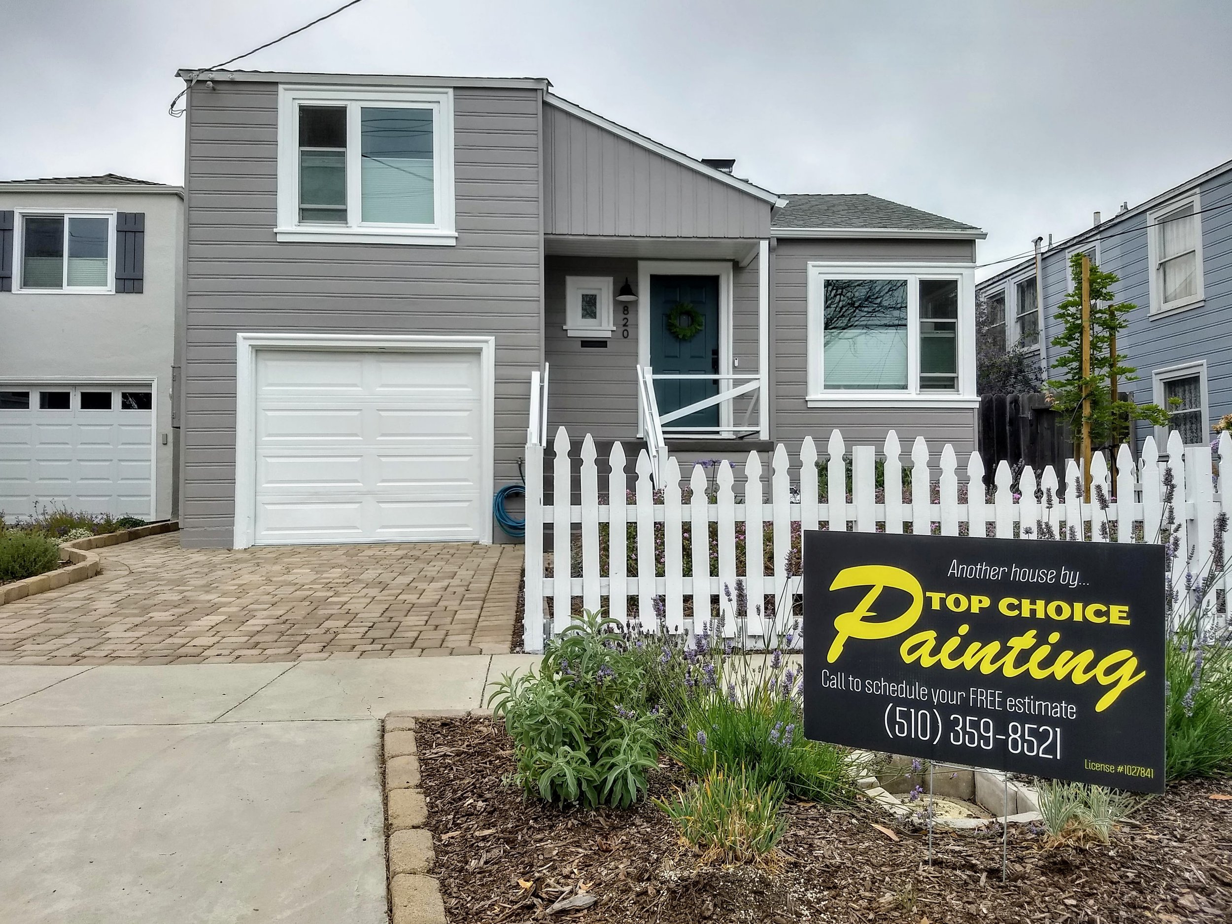 Exterior house painting of siding, trim, and front door completed in El Cerrito, CA
