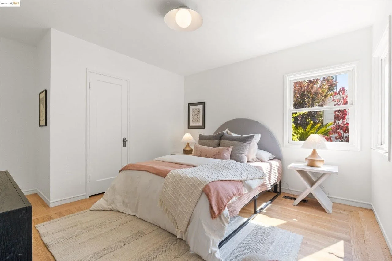 A fresh coat of bright white paint was applied to the bedroom ceiling, walls, and trim in this house located in the Oakland Hills.