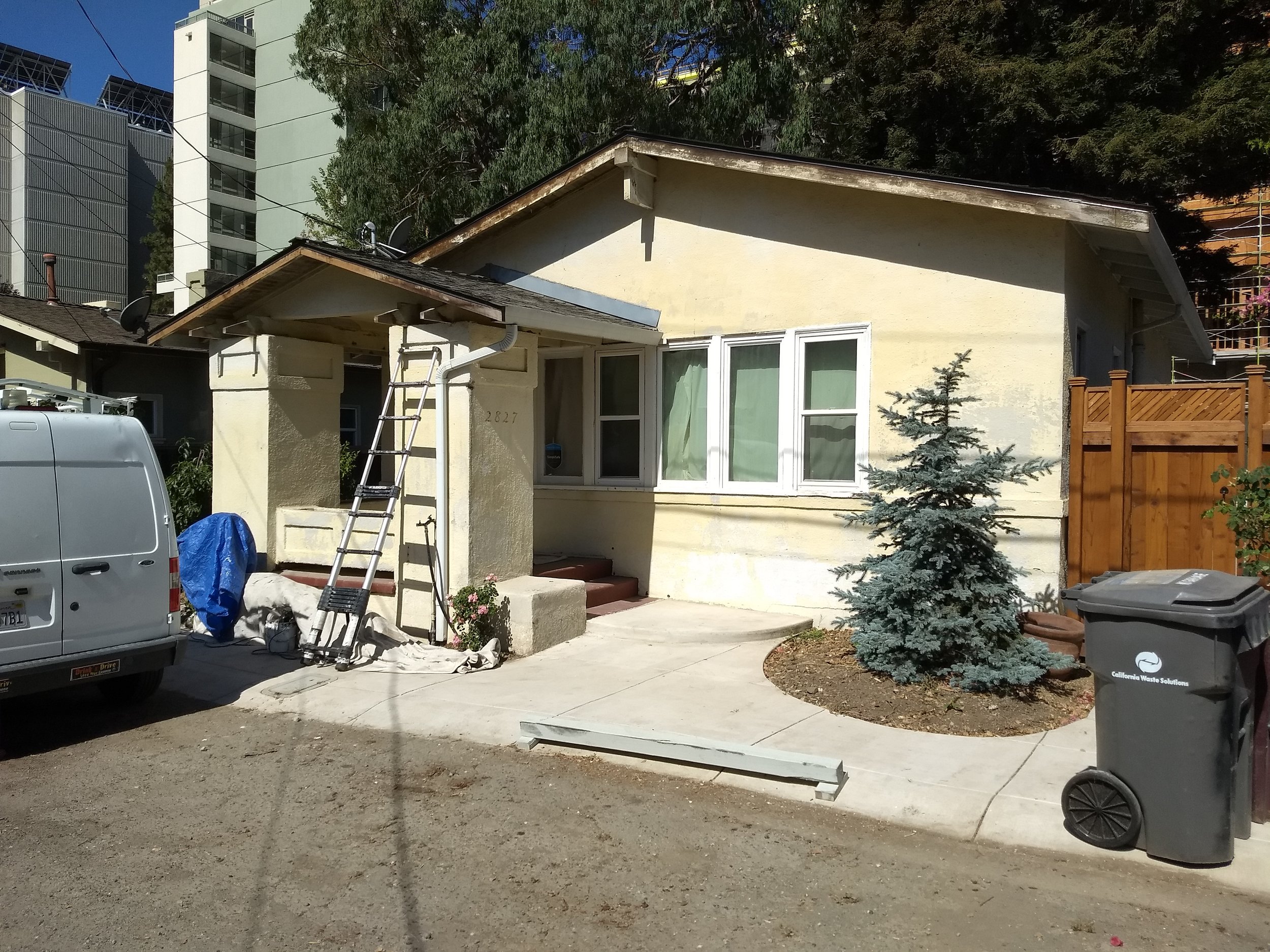 Exterior house painting project showing refreshed siding and trim on a residential home in Oakland, CA. Before Photo