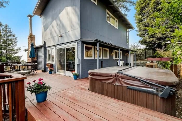 Exterior house repaint with fresh siding and trim paint completed in Oakland, California.