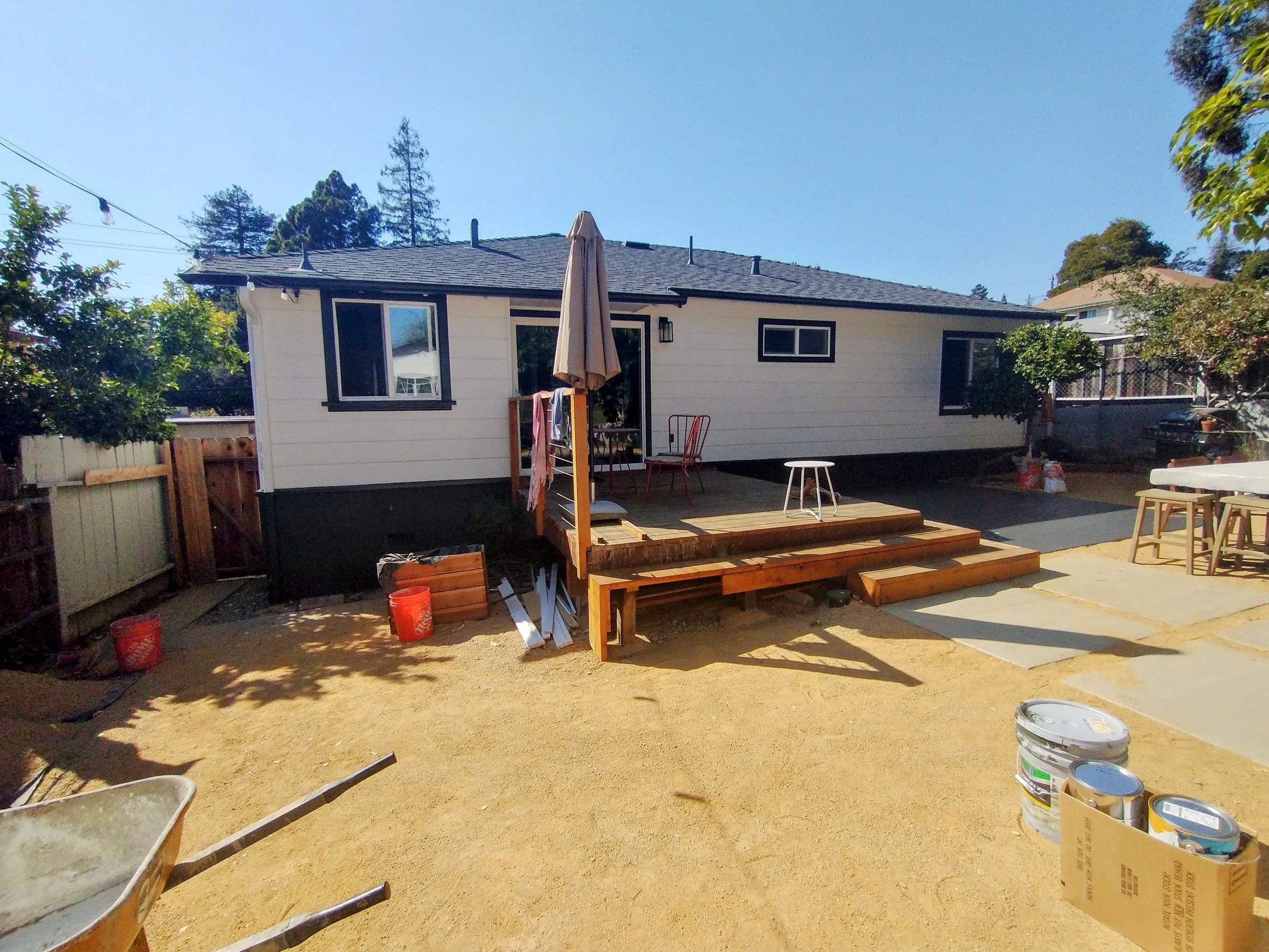 Exterior home transformation with new paint on siding, trim, and doors in Oakland, CA.