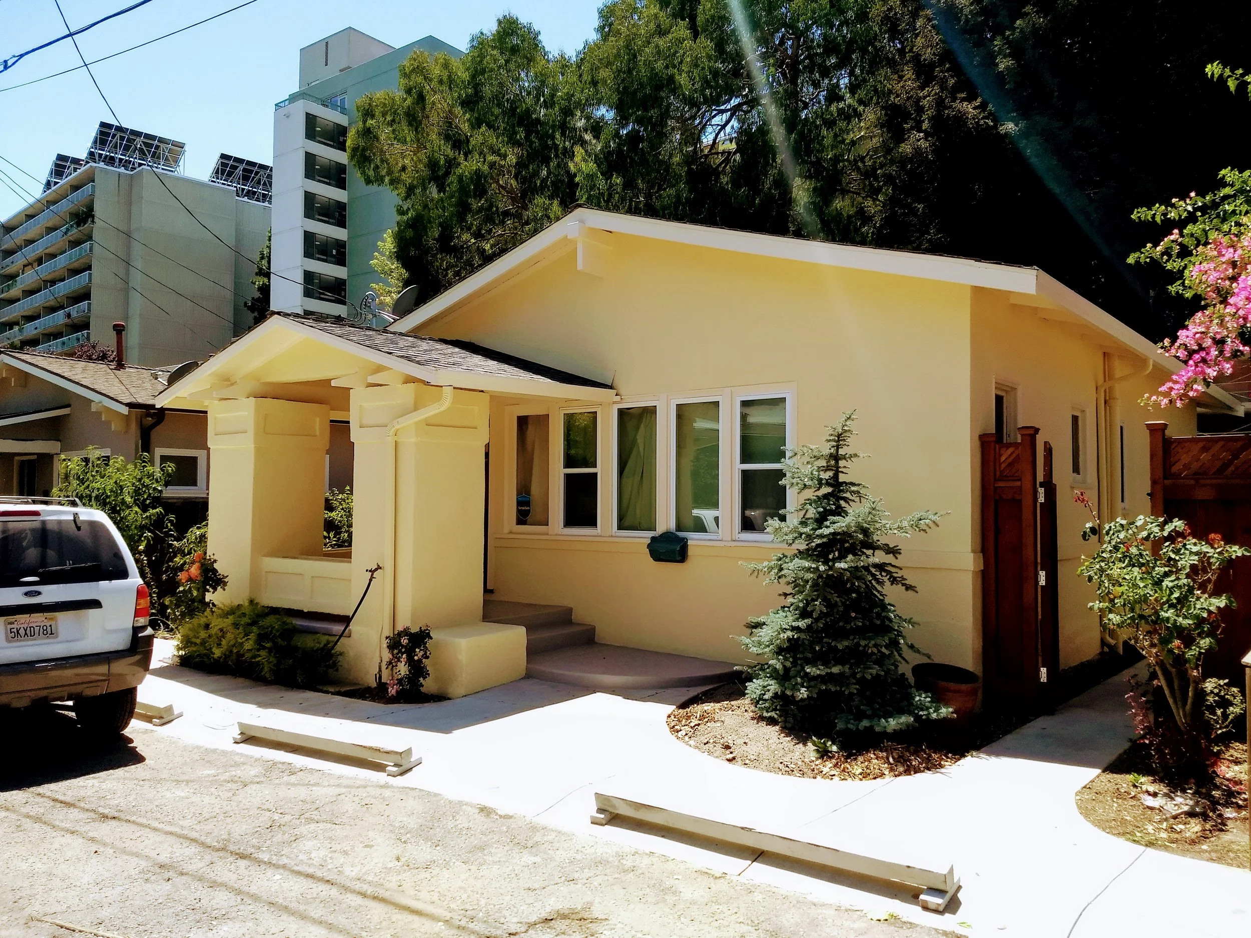 Exterior house painting project showing refreshed siding and trim on a residential home in Oakland, CA. After photo