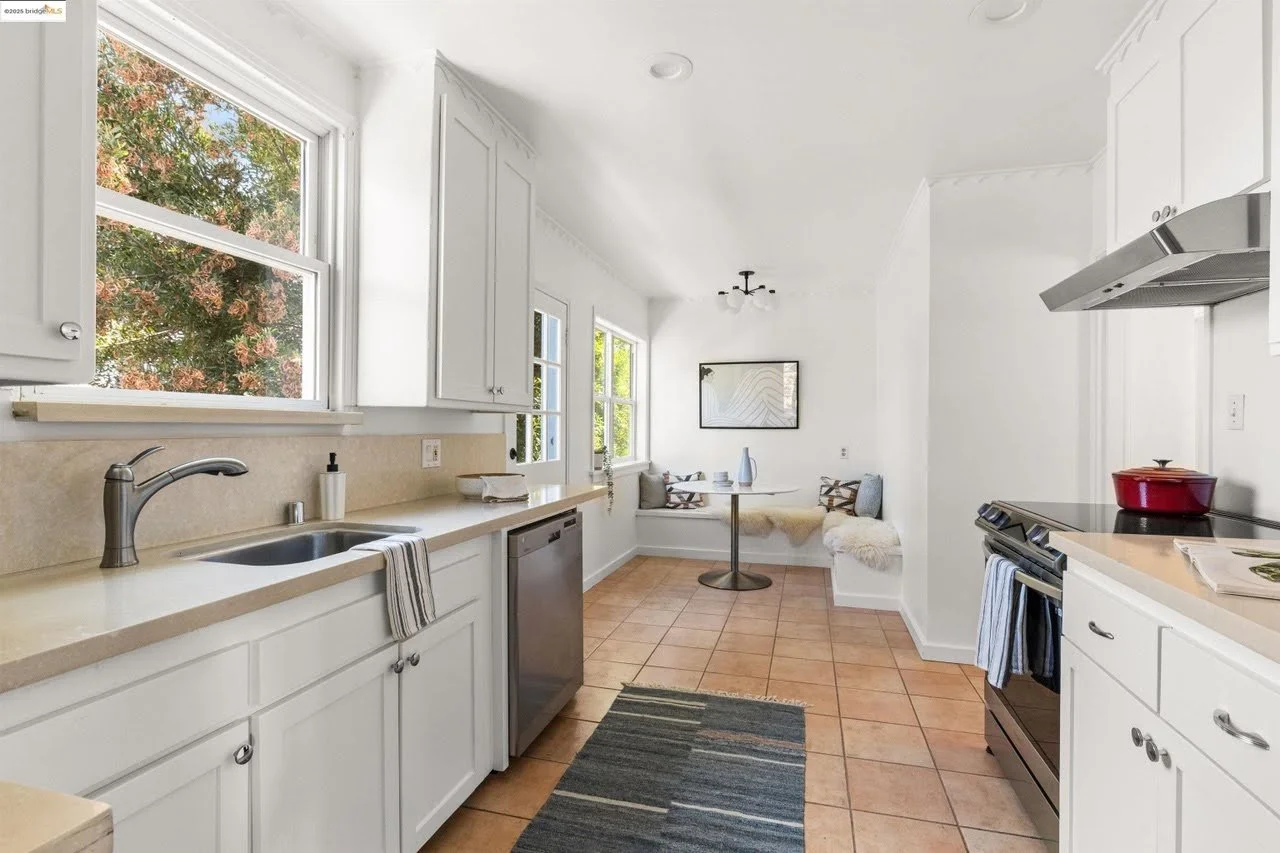 Durable paint was applied to the ceiling, walls, and trim in the kitchen located in the Oakland Hills. Cabinet paint was applied using an airless sprayer.