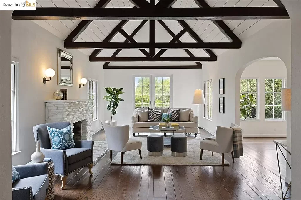 Paint was applied the shiplap ceiling, the walls, the trim, and to the stone fireplace in this living room located in the Oakland Hills.
