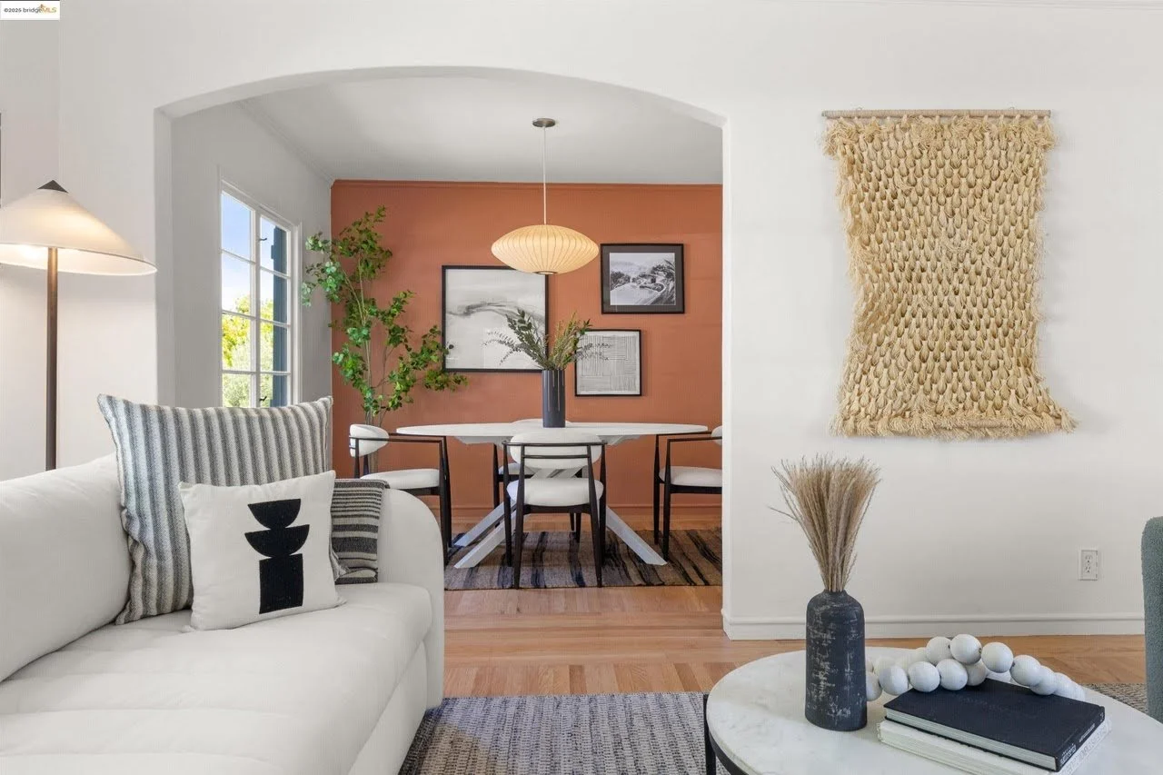 The ceiling, walls, and trim got a fresh coat of white paint in this living room in the Oakland Hills. You can see the accent wall in the dining room. 