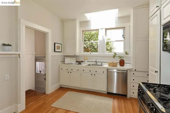 A durable coat of paint was applied to the ceiling, walls, cabinets, and trim in this kitchen located in Piedmont.