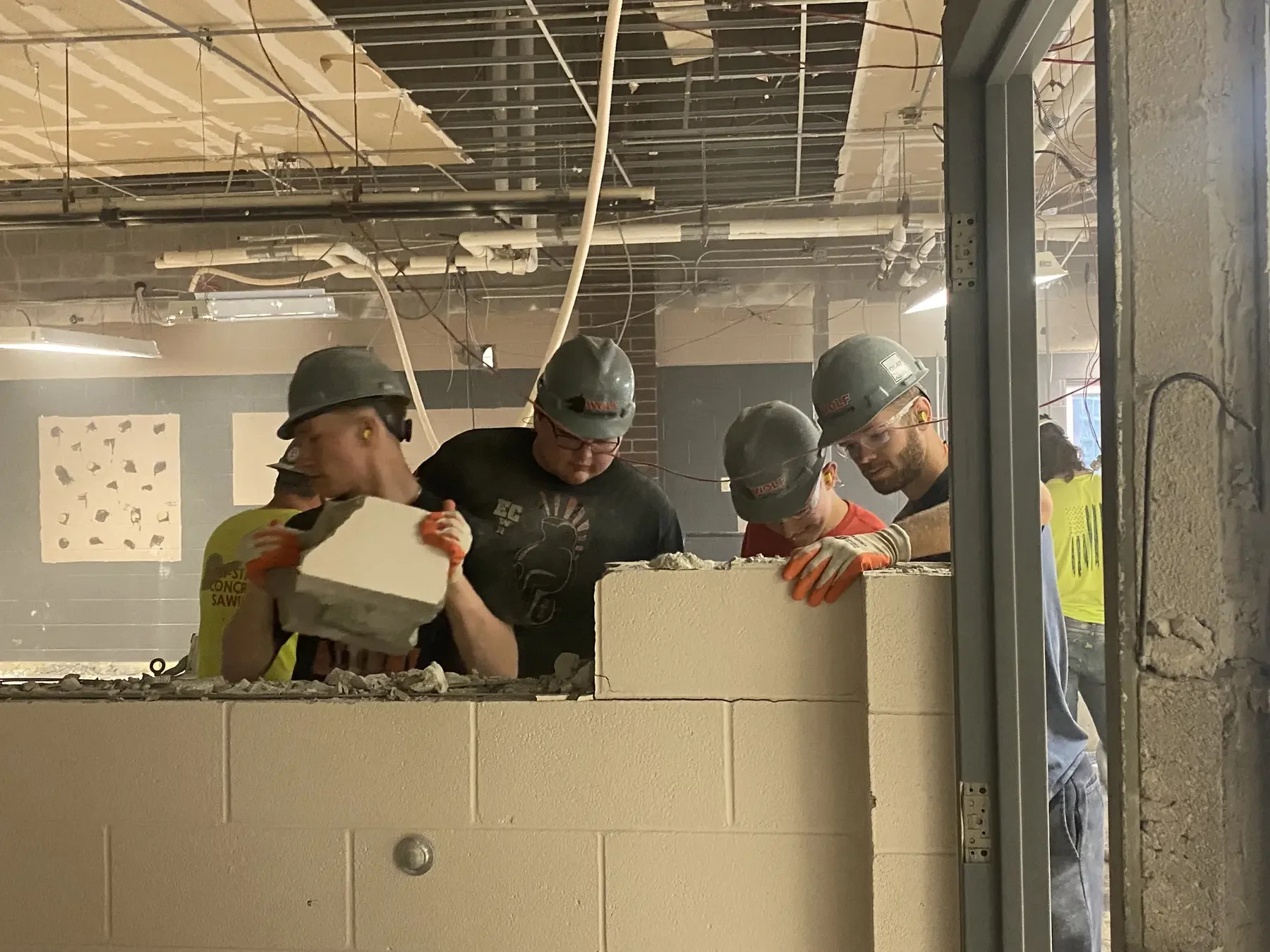 Wolf Contracting crew performing controlled masonry removal