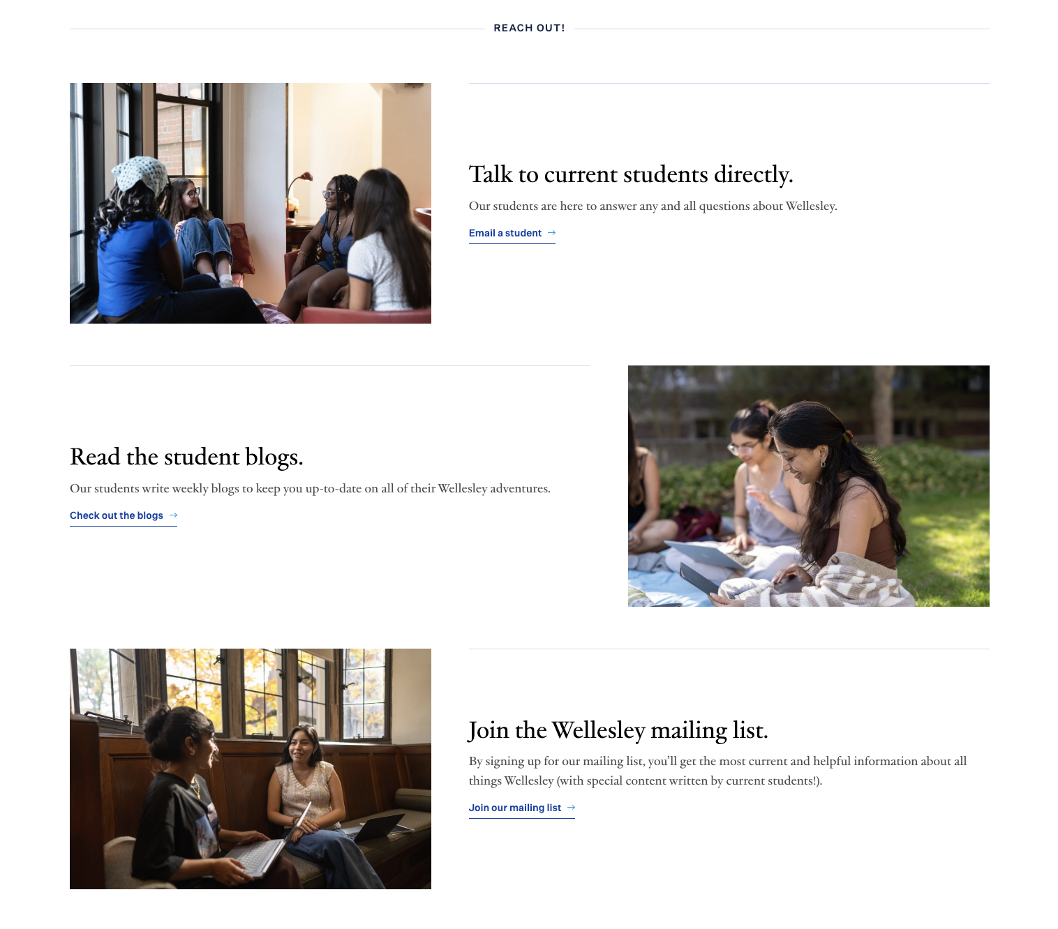 Three women sitting on the grass outside, using laptops and phones, engaged in conversation, with a blurred background of trees and buildings.