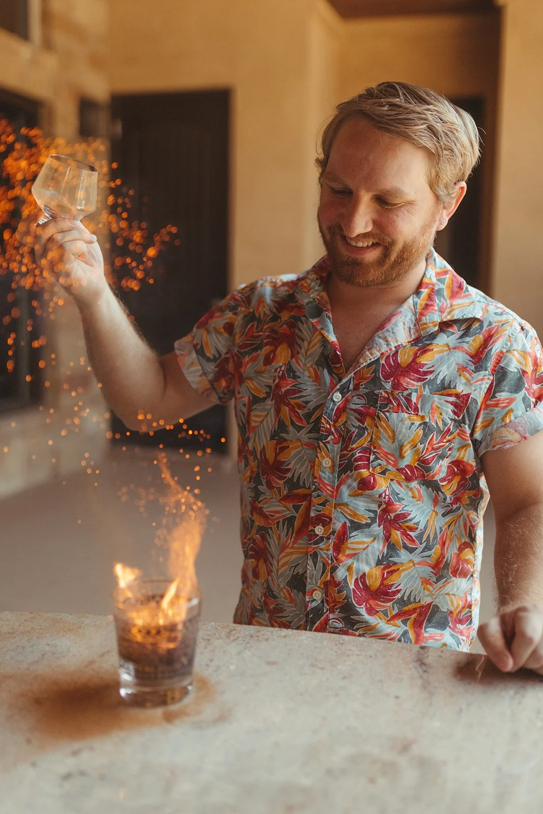 Caleb Ryan Davis, owner of Aloha Cocktail Co. adding fire and flair to a drink