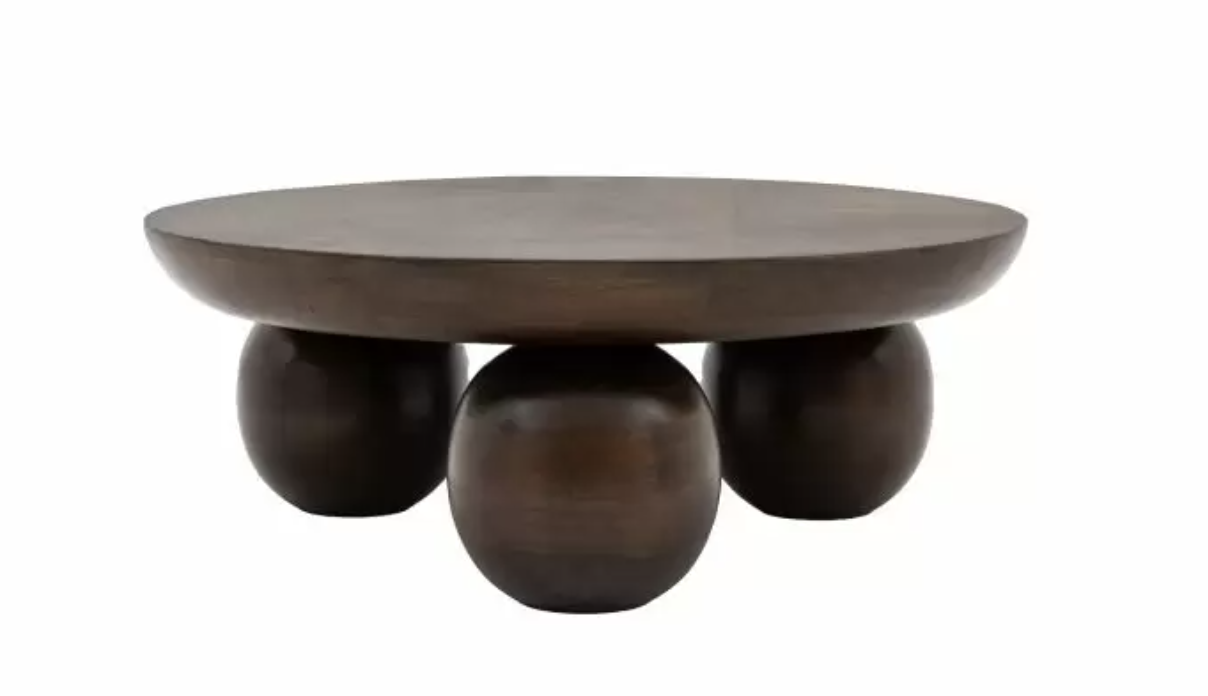 Offering a dramatic retro look, this stunning coffee table is crafted from mango wood solids which have a rich deep finish. The chunky top gently curves away on the underside, with turned ball feet completing the look. Coordinating items are availabl