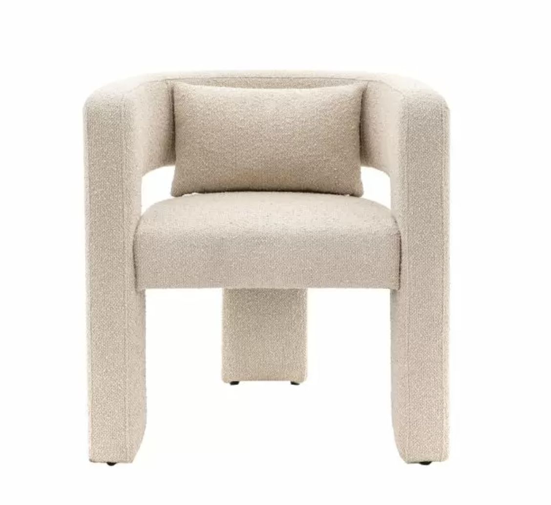 This eye-catching occasional chair adds a stunning, bold design touch to a room. It is fully upholstered in a lovely neutral fabric, with a bolster cushion for added comfort.