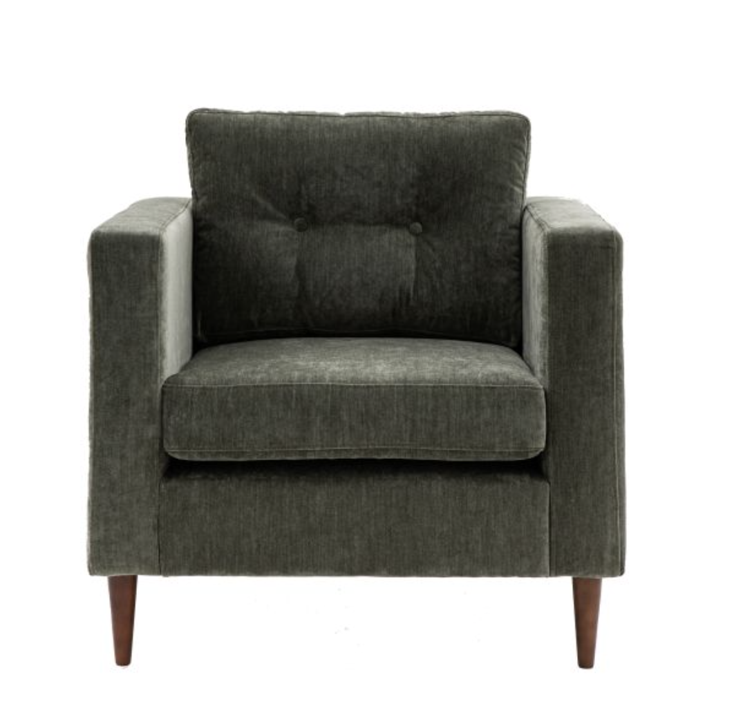 Offering stylish contemporary design, this lovely armchair features sleek lines with block arms and button detailing on the back paired with elegant tapered wooden feet. It is upholstered in a lovely green fabric but is also available in grey and nat