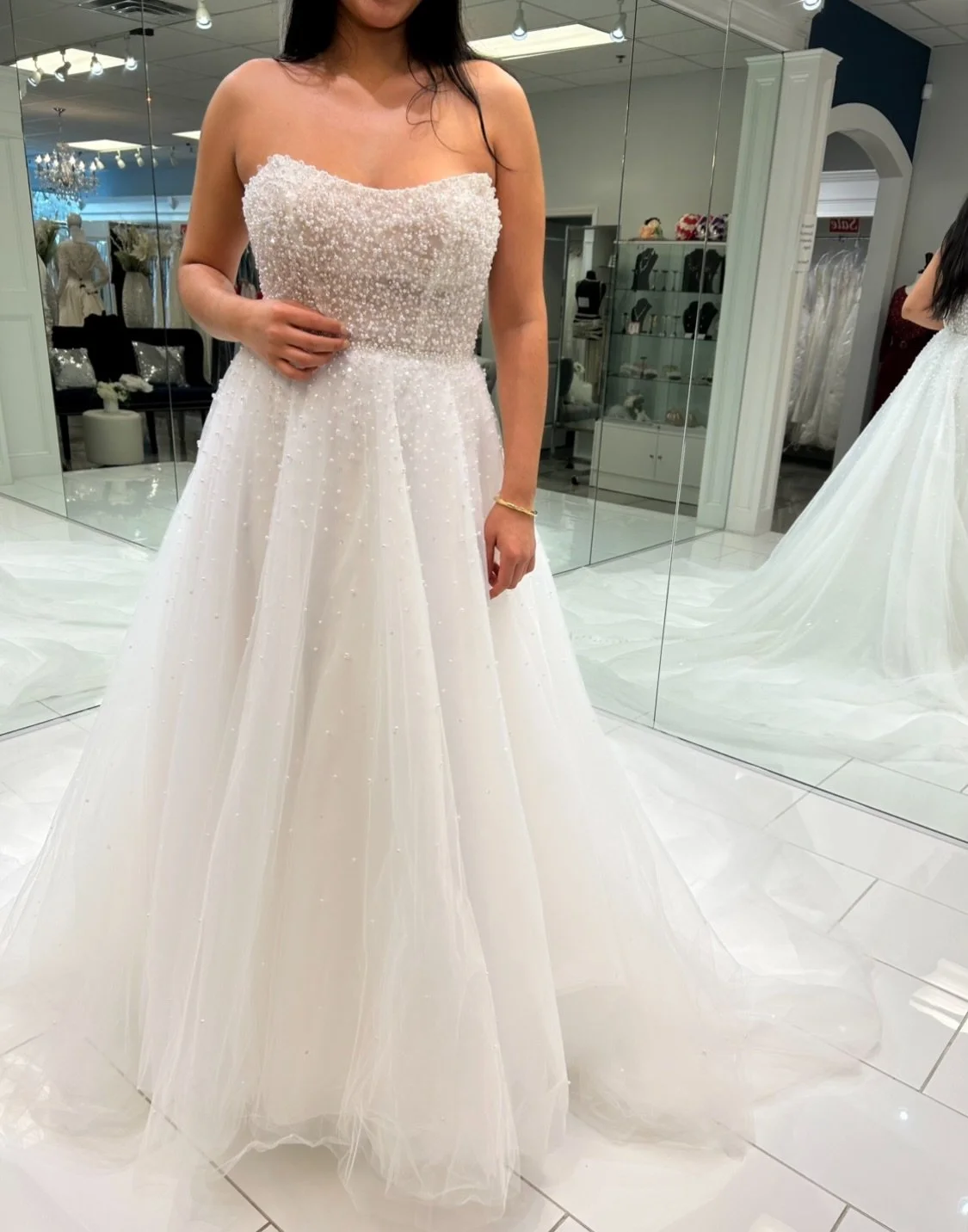 From the structured, strapless bodice to the cascade of shimmer down that floaty tulle skirt&hellip; she&rsquo;s not just walking down the aisle, she&rsquo;s gliding 🤩✨
.
.
.
#nataliesbridalsbybb #weddingdress #bride #aline #bridalboutique