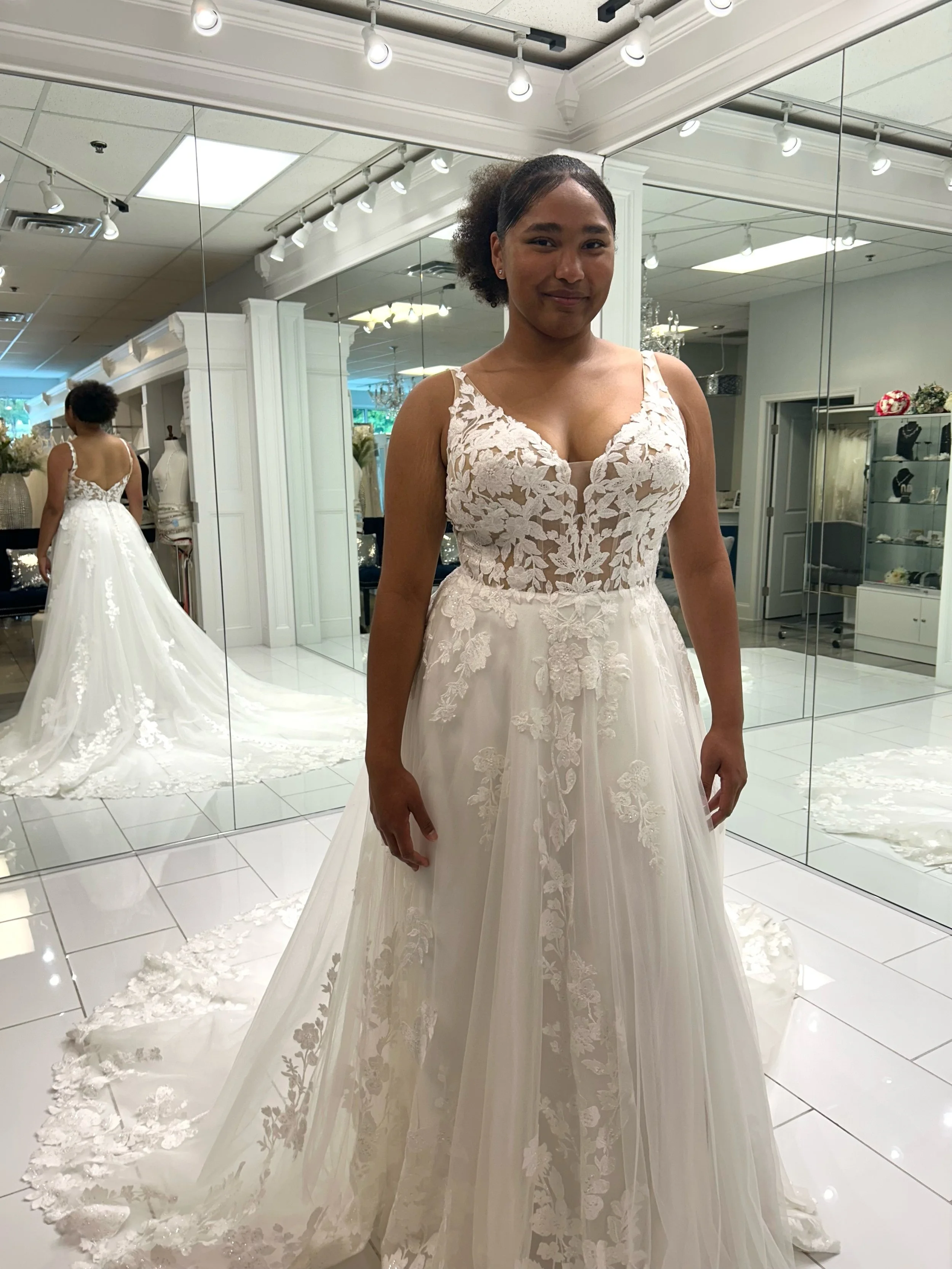 If romance were a wedding dress.. this would be it 🥰🌸Delicate floral appliqu&eacute;s, soft shimmer, and a dreamy train that comes together in the most enchanting A-line silhouette 💕
.
.
.
#nataliesbridalsbybb #weddingdress #romantic
#bridalshop #