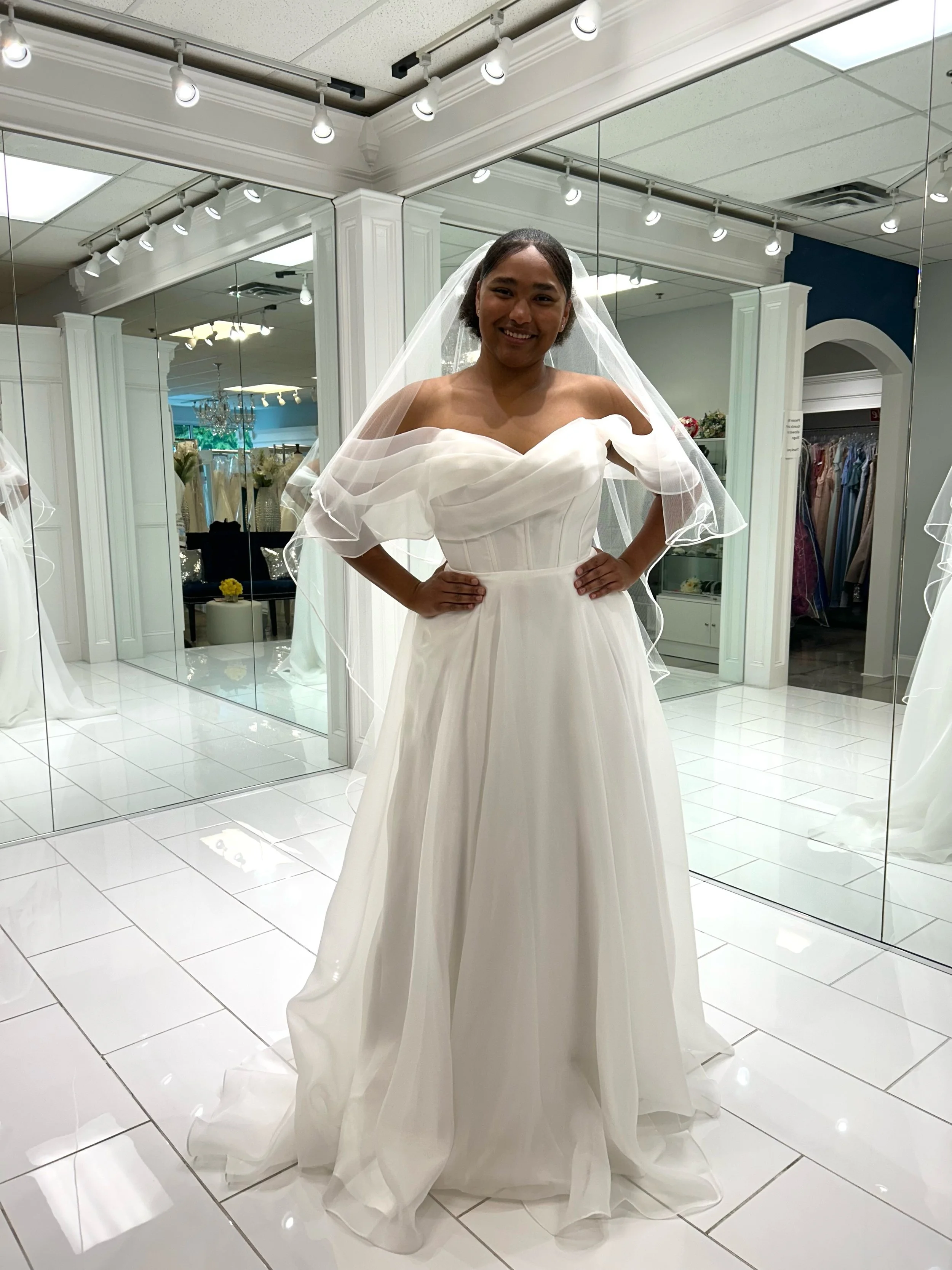 This stunning organza ball gown combines timeless elegance with a romantic off the shoulder sleeves and fairytale bridal charm 🤍✨ Paired with a satin edge veil, it&rsquo;s perfect for brides who love a sophisticated &amp; graceful look ☺️
.
.
.
#nat