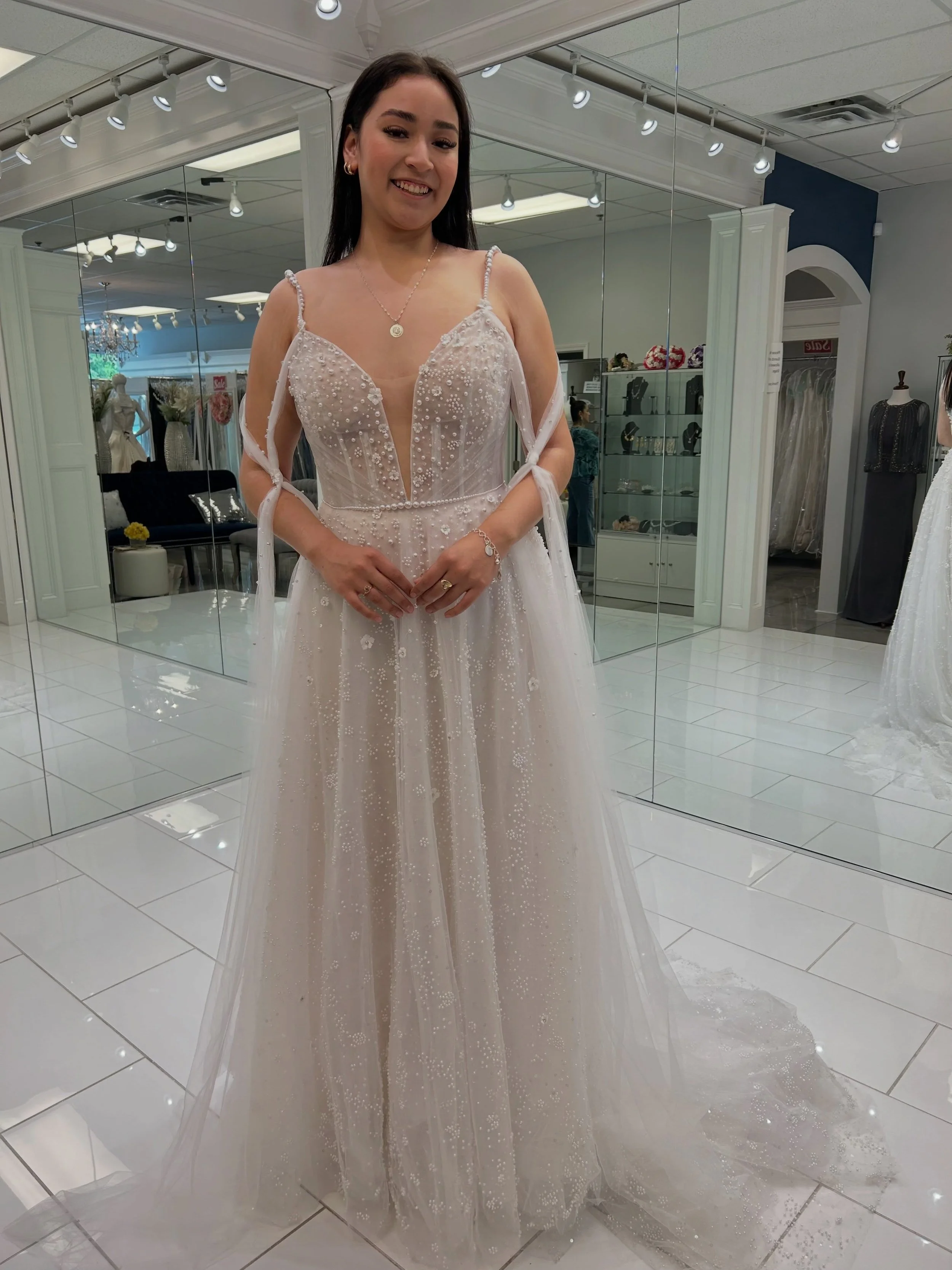 Every detail tells a story ☁️✨ Featuring a heavily beaded illusion bodice, delicate floral accents, and airy statement sleeves, this ethereal A-line wedding dress is the perfect blend of romance and elegance 💕
.
.
.
#nataliesbridalsbybb #weddingdres