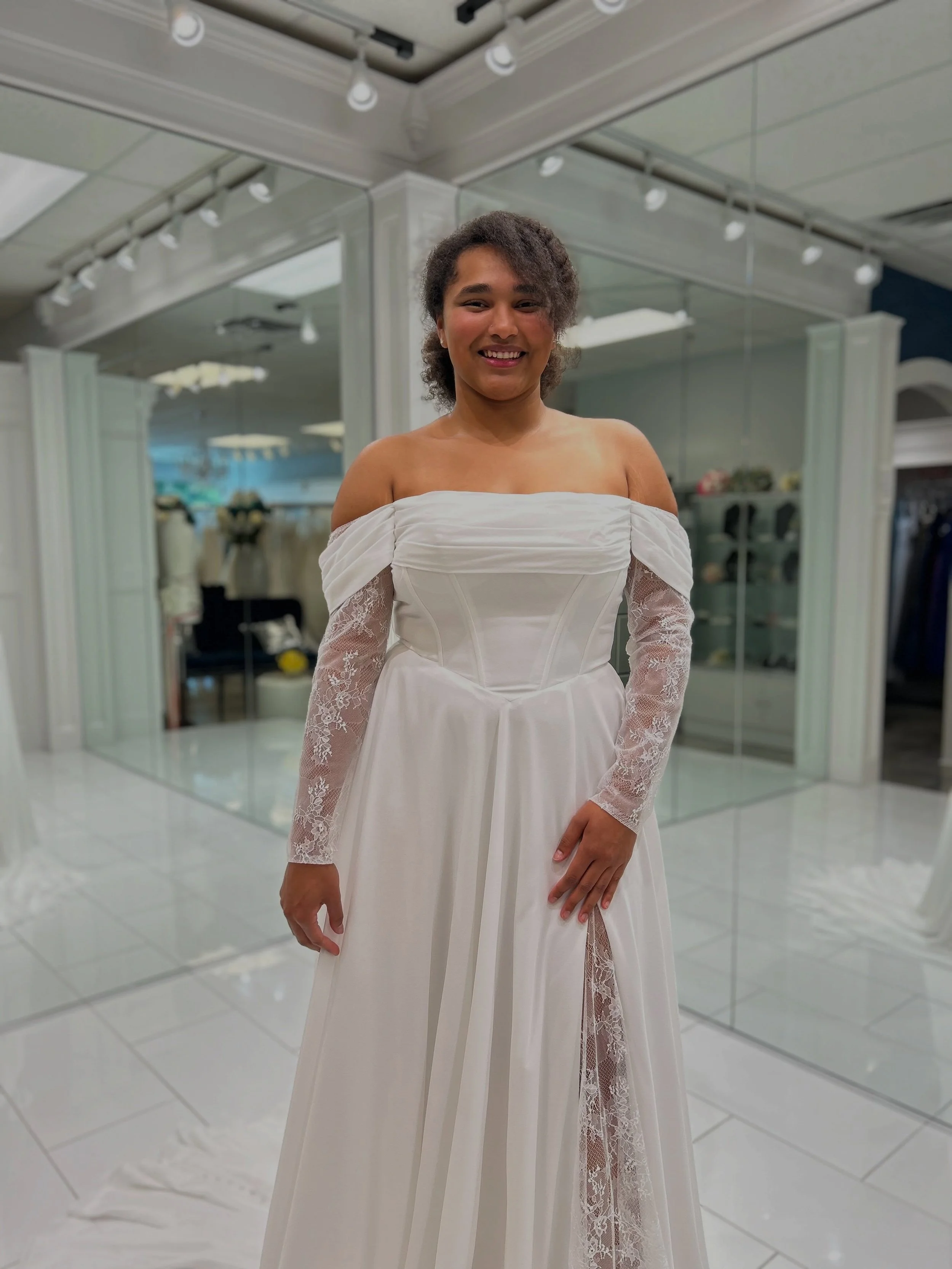 There&rsquo;s just something about lace, chiffon, and off the shoulder sleeves that will make bridesmaids feel like they stepped into their own fairytale ☺️✨ Timeless &amp; romantic A-line 🤍 Book your appointment with us to try on this beauty 🥰
.
.