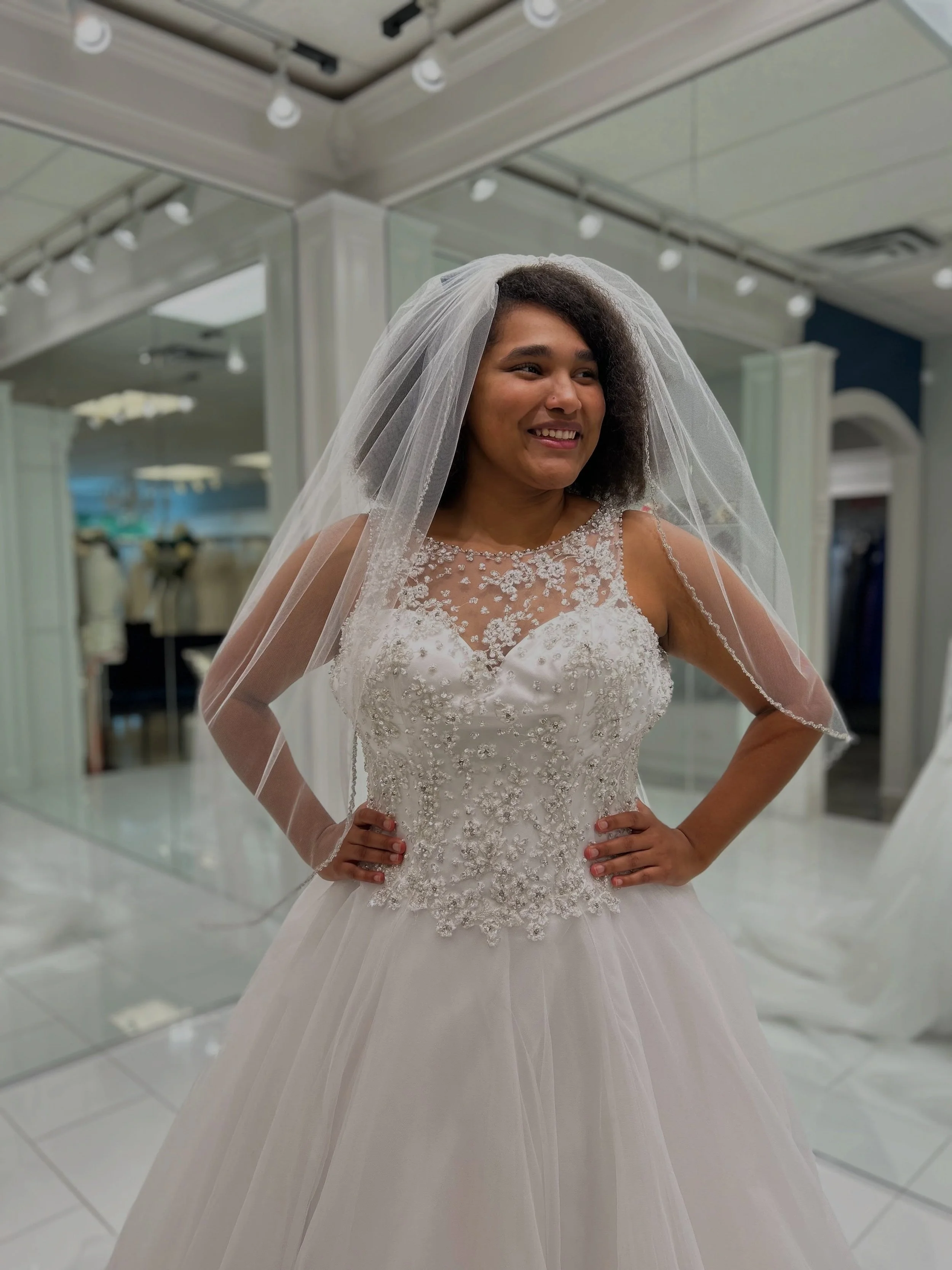 This beaded ball gown brings all the sparkle with its beautiful detailed bodice and the fingertip veil takes it one step further with beading that perfectly matches the dress 😍✨ Ready to find your dream wedding dress? Book your appointment with us t