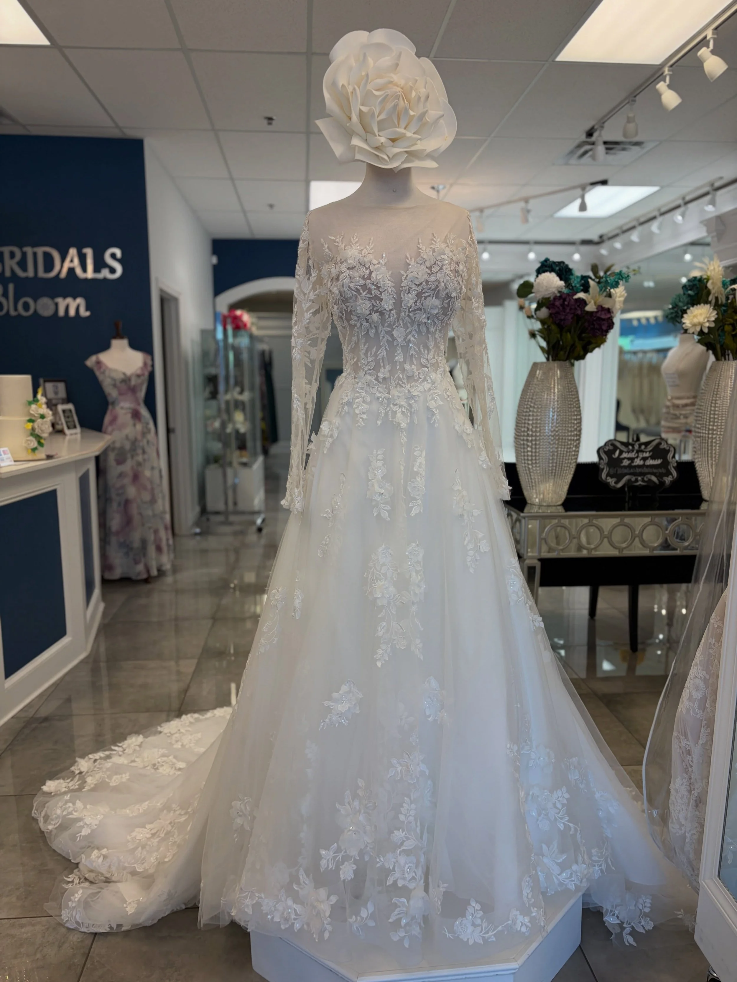 Proof that sometimes you just need to look a little closer 🥹👀 The lace. The 3D florals. Illusion neckline 🌸✨ This gown is made for the bride who loves a little romance, sparkle, and a whole lot of beautiful details 🤍
.
.
.
#nataliesbridalsbybb #w