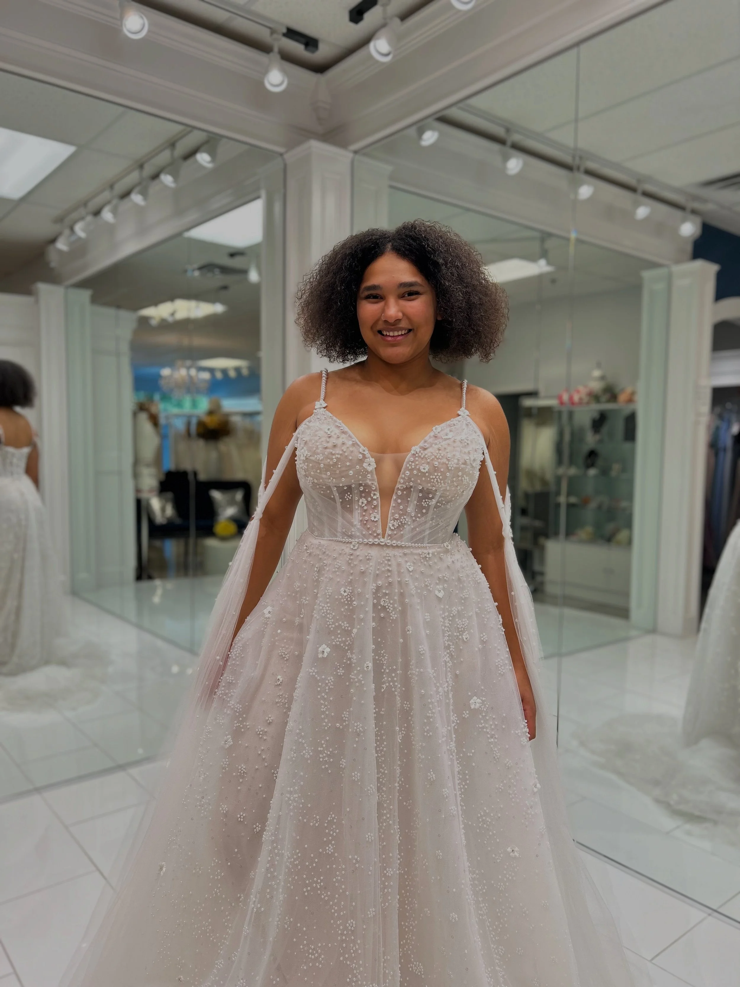 This wedding gown has the dreamiest details ☁️💕 From gorgeous pearl beading, flowy off the shoulder sleeves, and floral detailing 🌸 Definitely gives an ethereal &amp; whimsical look 😇 If you&rsquo;ve been dreaming of a gown that feels a bit magica
