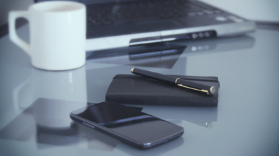Desktop with pen and notebook.png