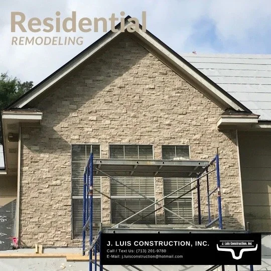 House under renovation with scaffolding in front, showcasing residential remodeling by J. Luis Construction, Inc.
