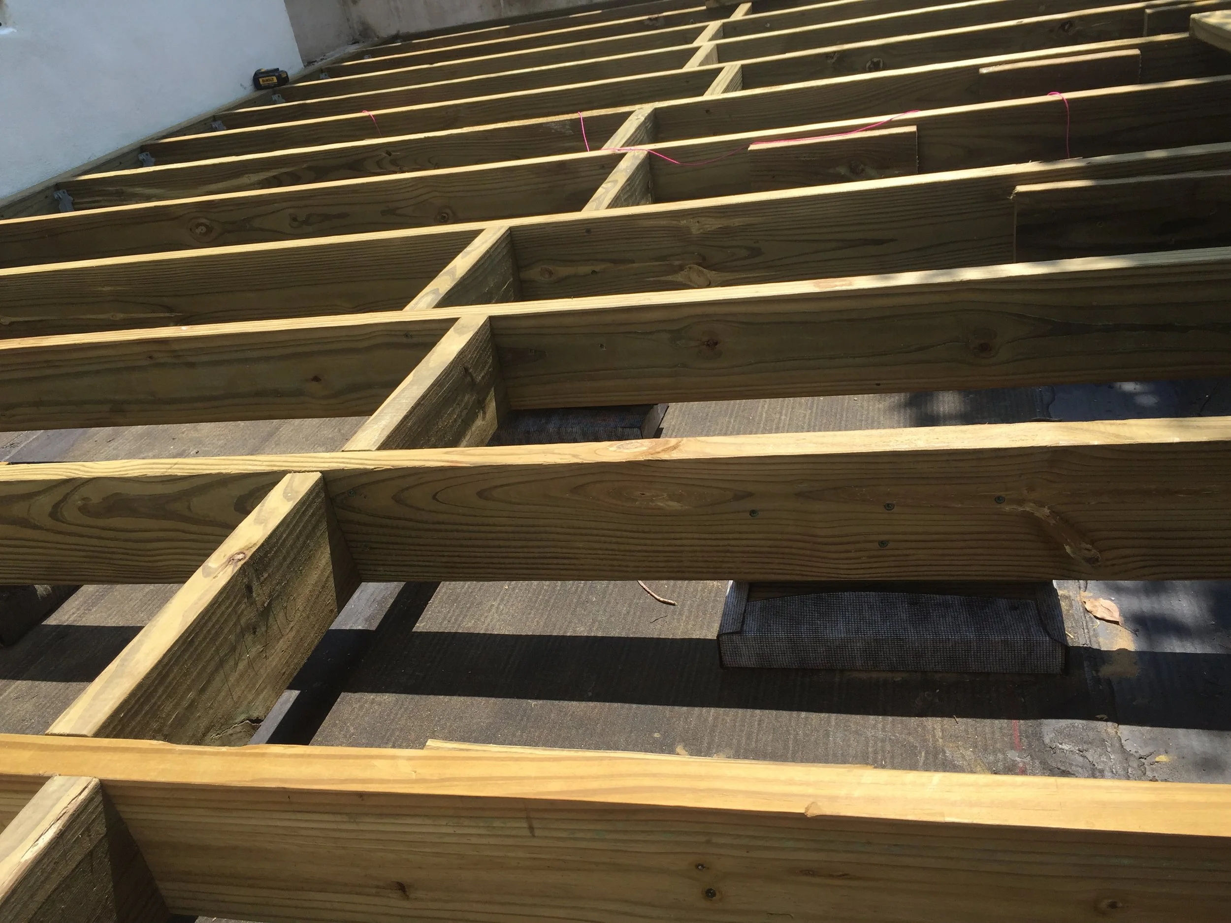 Wooden deck framing under construction