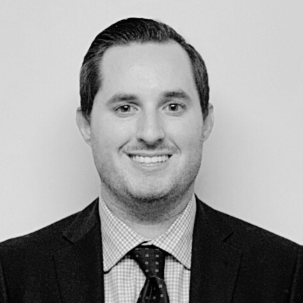 Black and White headshot of Michael Odell, Director of Client Services of Proud Impact Collective