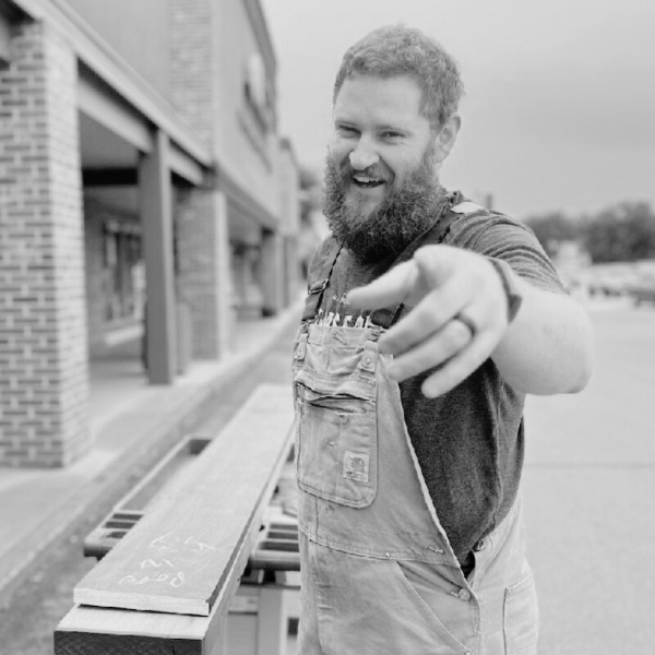 Black and White headshot of Alex Jangard, VP Digital and Social Commerce of Proud Impact Collective