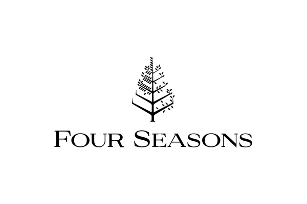 A logo with a stylized black tree and the words "Four Seasons" underneath on a white background.