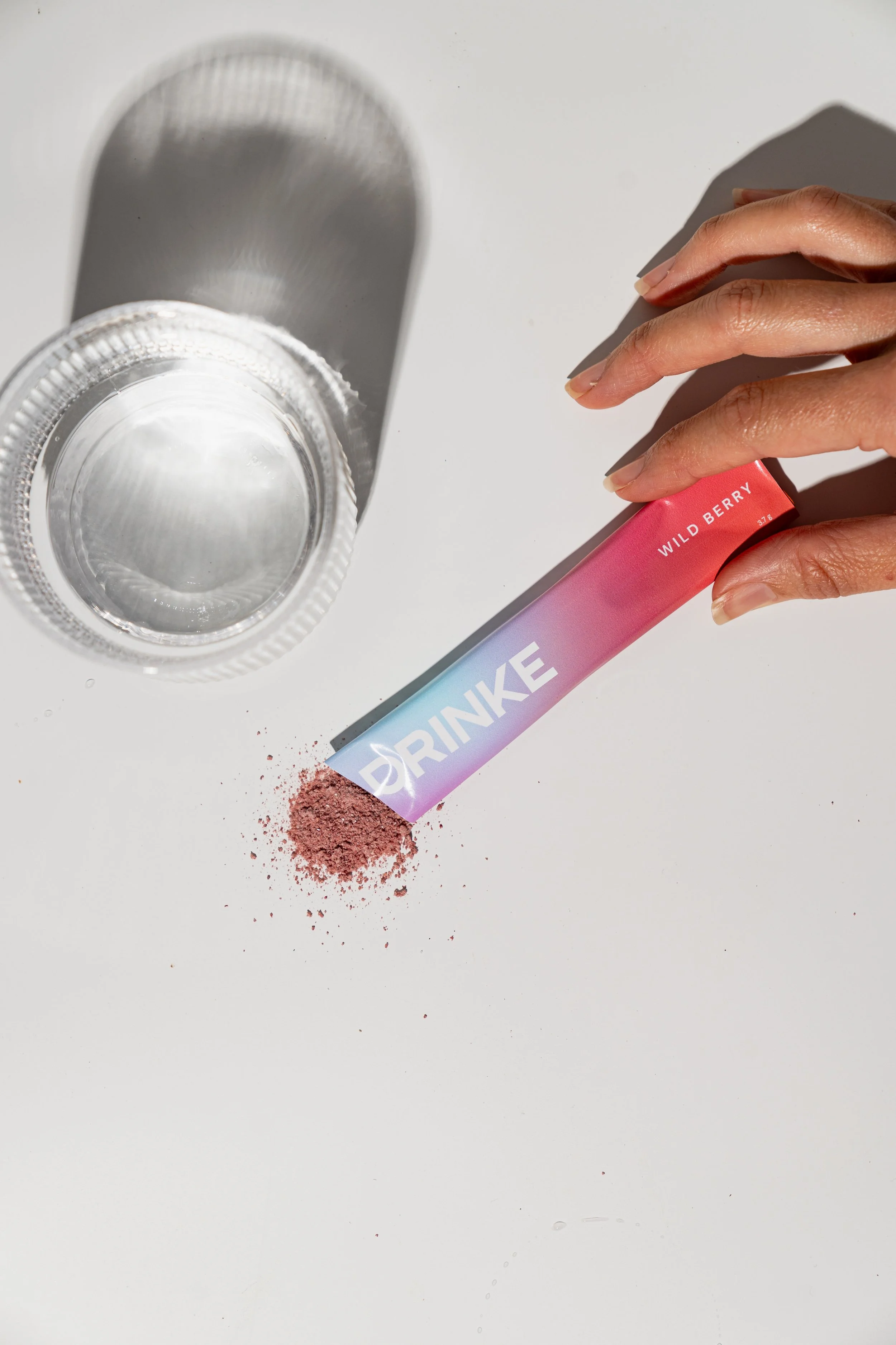 An image of a sachet with contents spilling out