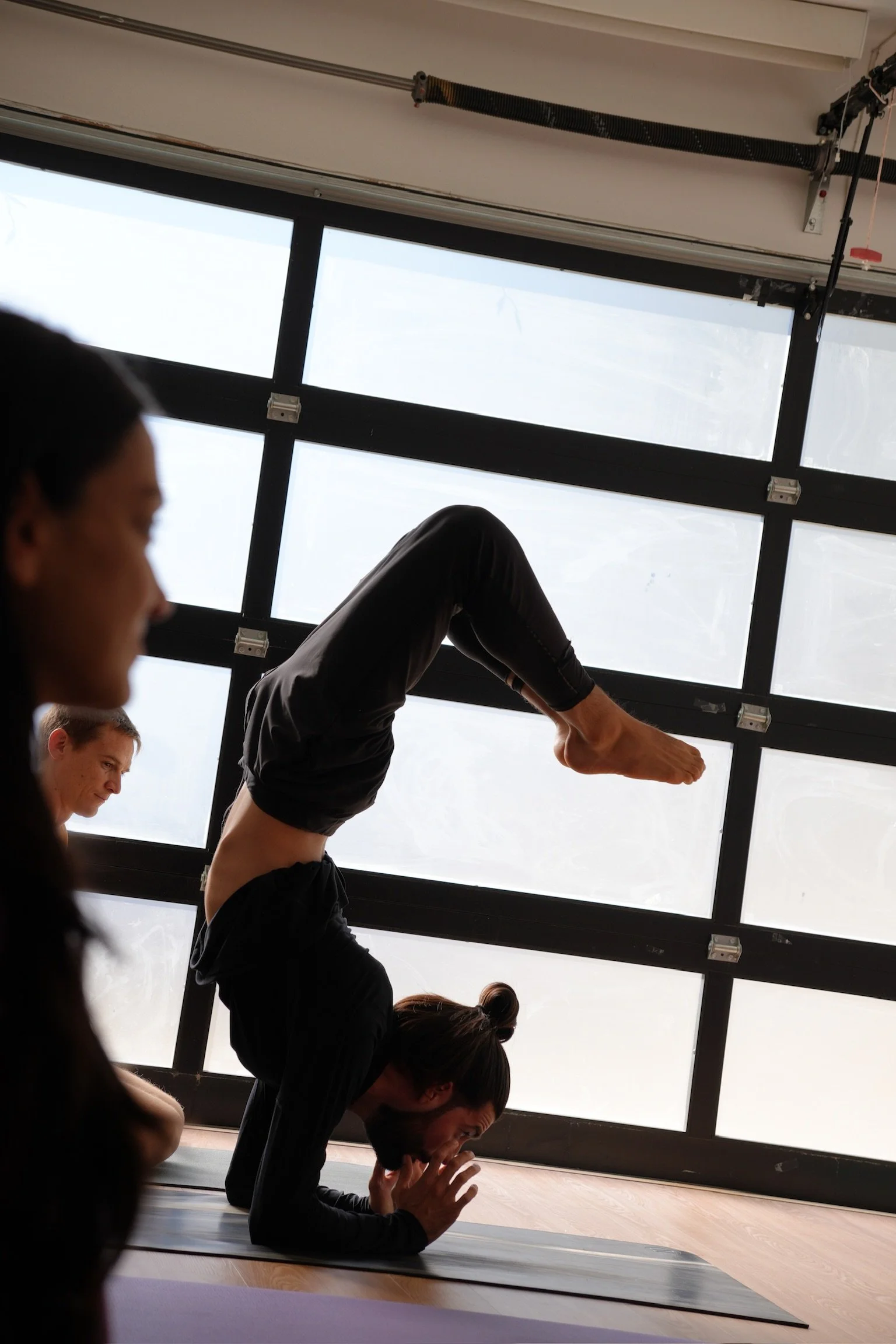 Caio Amaral practicing Sayanasana transition to Parivrittasana in Ashtanga Yoga Advanced Series 