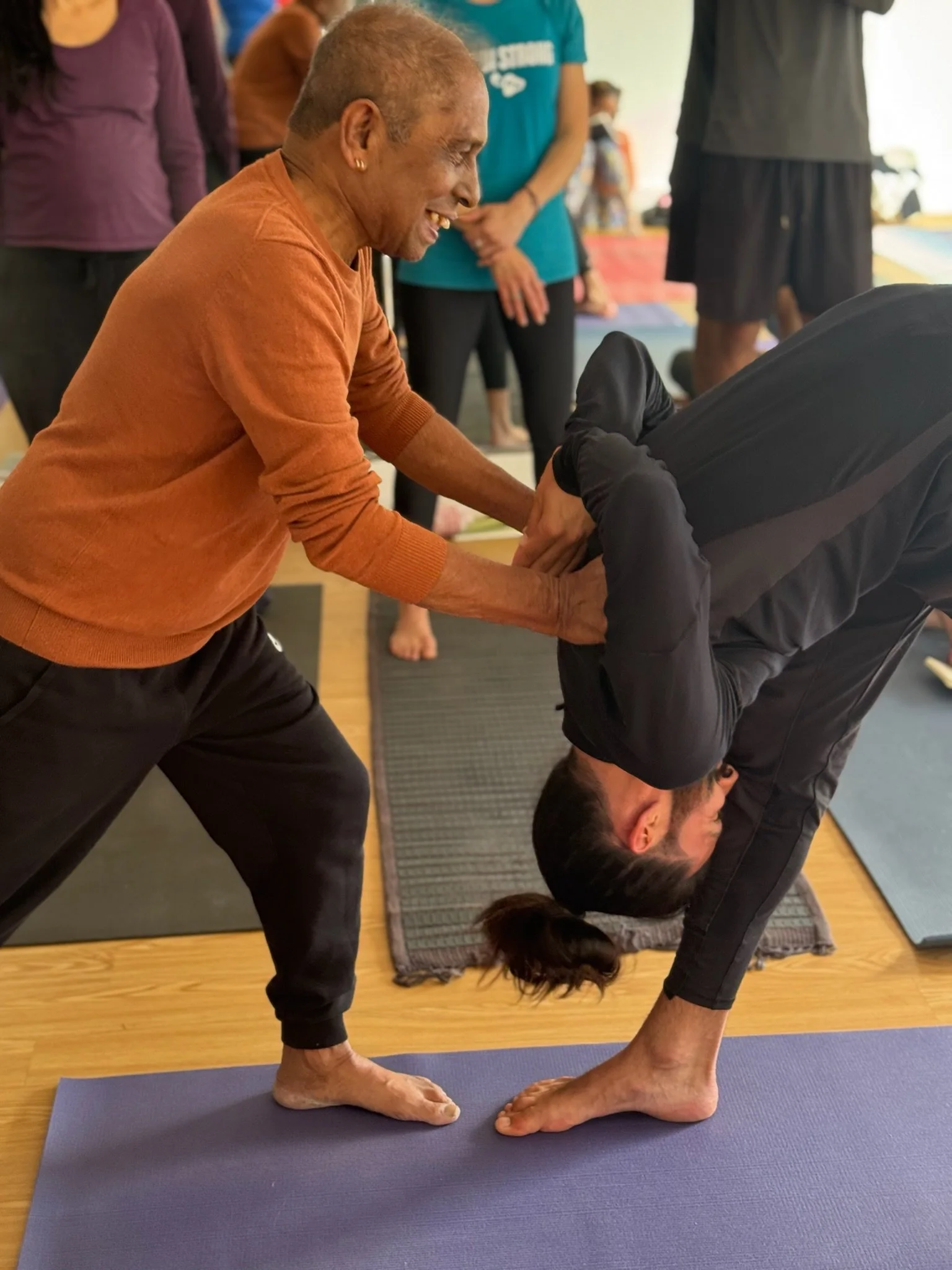 Manju P. Jois showing yoga therapy assist, Parsvottanasana, Encinitas, California